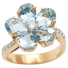 Bague aigue-marine et diamant sertie dans une monture en or rose 18 carats