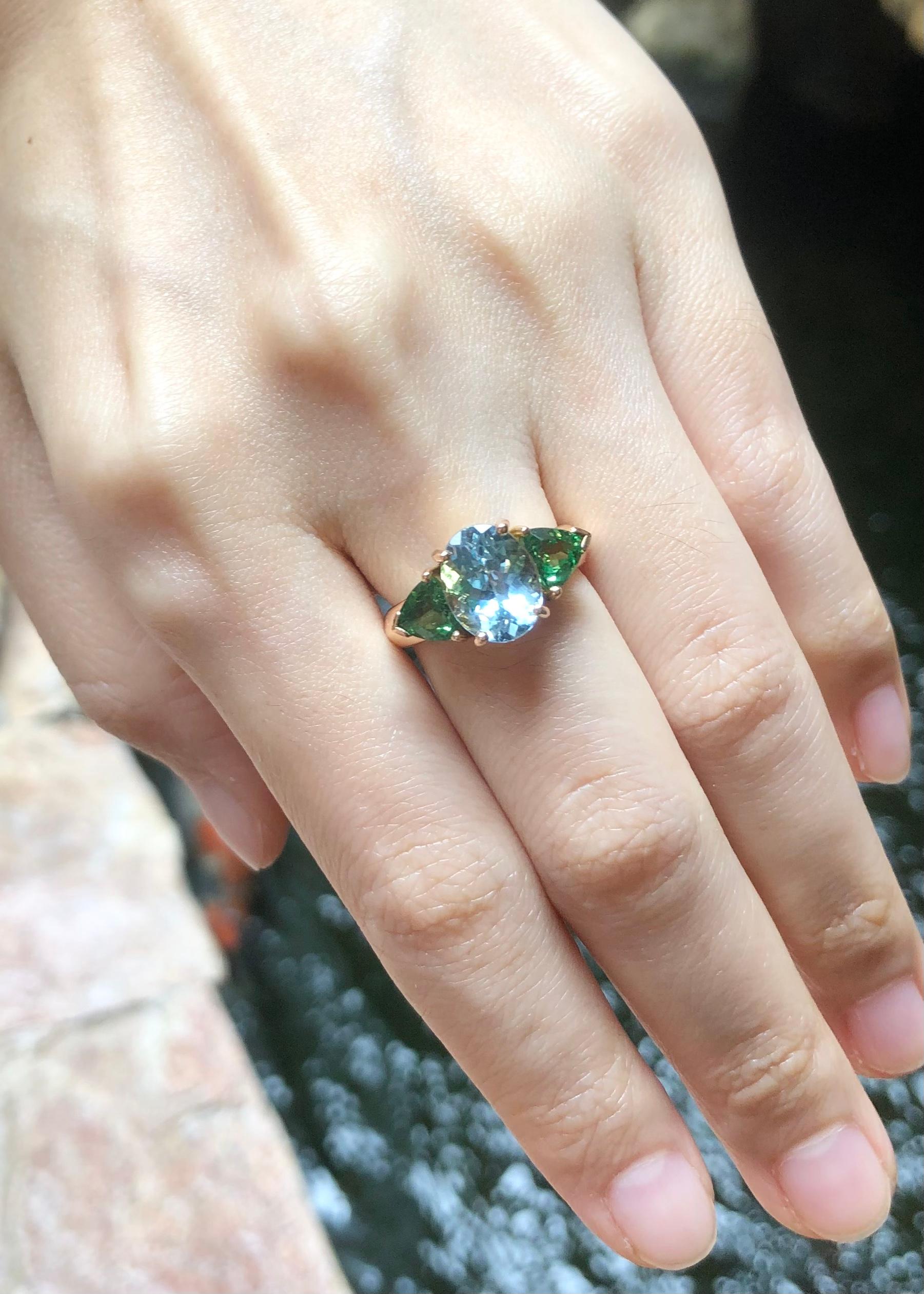 Aquamarine 2.74 carats with Tsavorite 1.31 carats Ring set in 18K Rose Gold Settings

Width:  1.8 cm 
Length: 1.0 cm
Ring Size: 51
Total Weight: 6.01 grams

