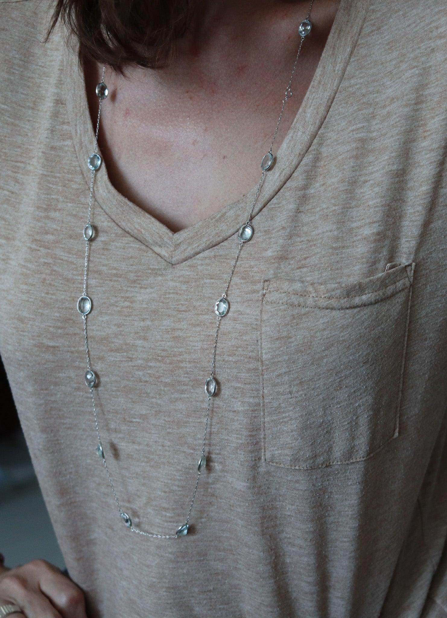 Aquamarines stations chain necklace sautoir.

This is a beautiful station long chain-necklace created in America between the 1940 and 1950. It was designed as a classic sautoir chain displaying twenty-one well matched Brazilian blue aquamarines
