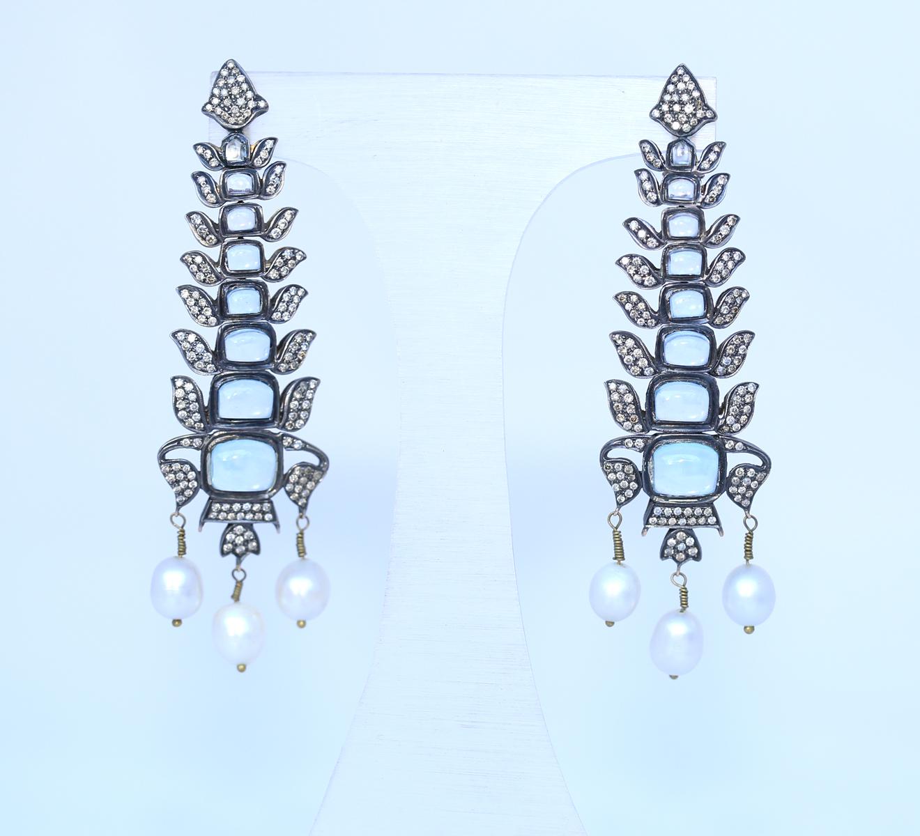 Massive Flexible Earrings with Aquamarines Diamonds and Pearls. A fine example of the jewelers great craftsmanship and imagination. Could be a prehistoric oceanic creature that was an inspiration for this fine item. Really long and massive the