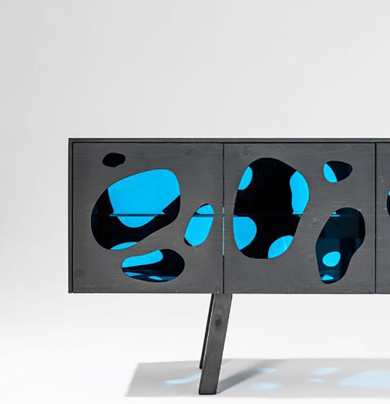 Aquario cabinet designed by Campana Brothers for BD Barcelona. The structure follows a highly unique and creative design. This unusual cabinet made with glass in a shape similar to water droplets veneered in natural ash or pine stained in grey which