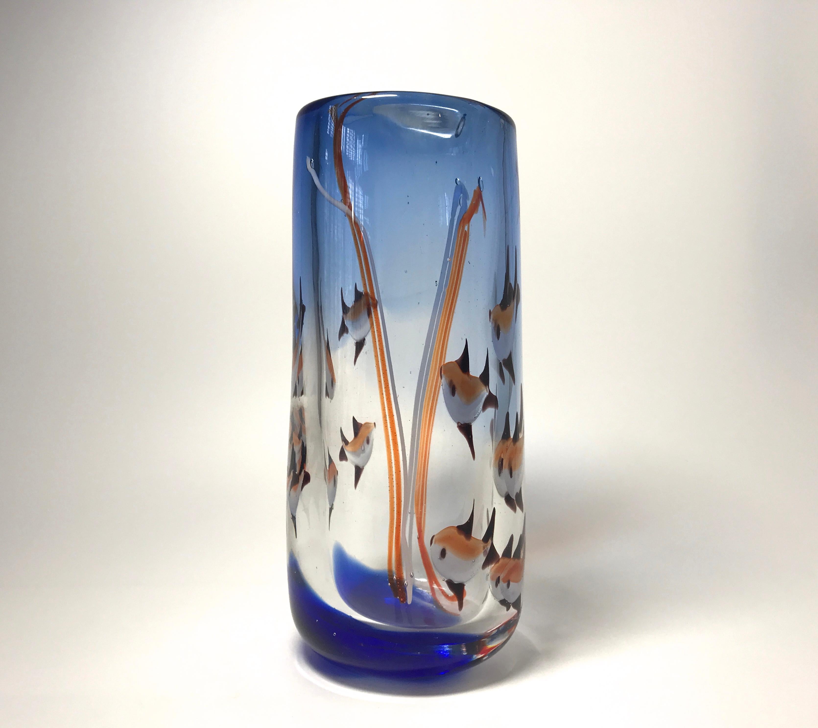 'Aquarium' tall heavyweight glass vase from Murano, Italy, created in the 1960s
Cobalt blue glass infused with fish, bubbles and reeds, a fun piece,
circa 1960
Measures: Height 8.5 inch, diameter 3.5 inch
In very good condition. Minor graze to