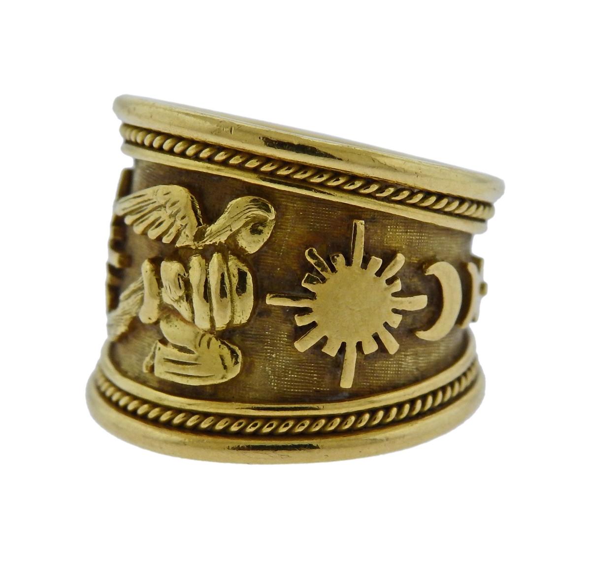 Aquarius Tapered Templar Zodiac Ring in 18k yellow gold wide band ring, crafted by Elizabeth Gage.  Zodiac ring featuring the Aquarius motif and decorated with the sun and moon motifs and the planets Venus and Mercury.  Ring size - 6, ring is 18mm