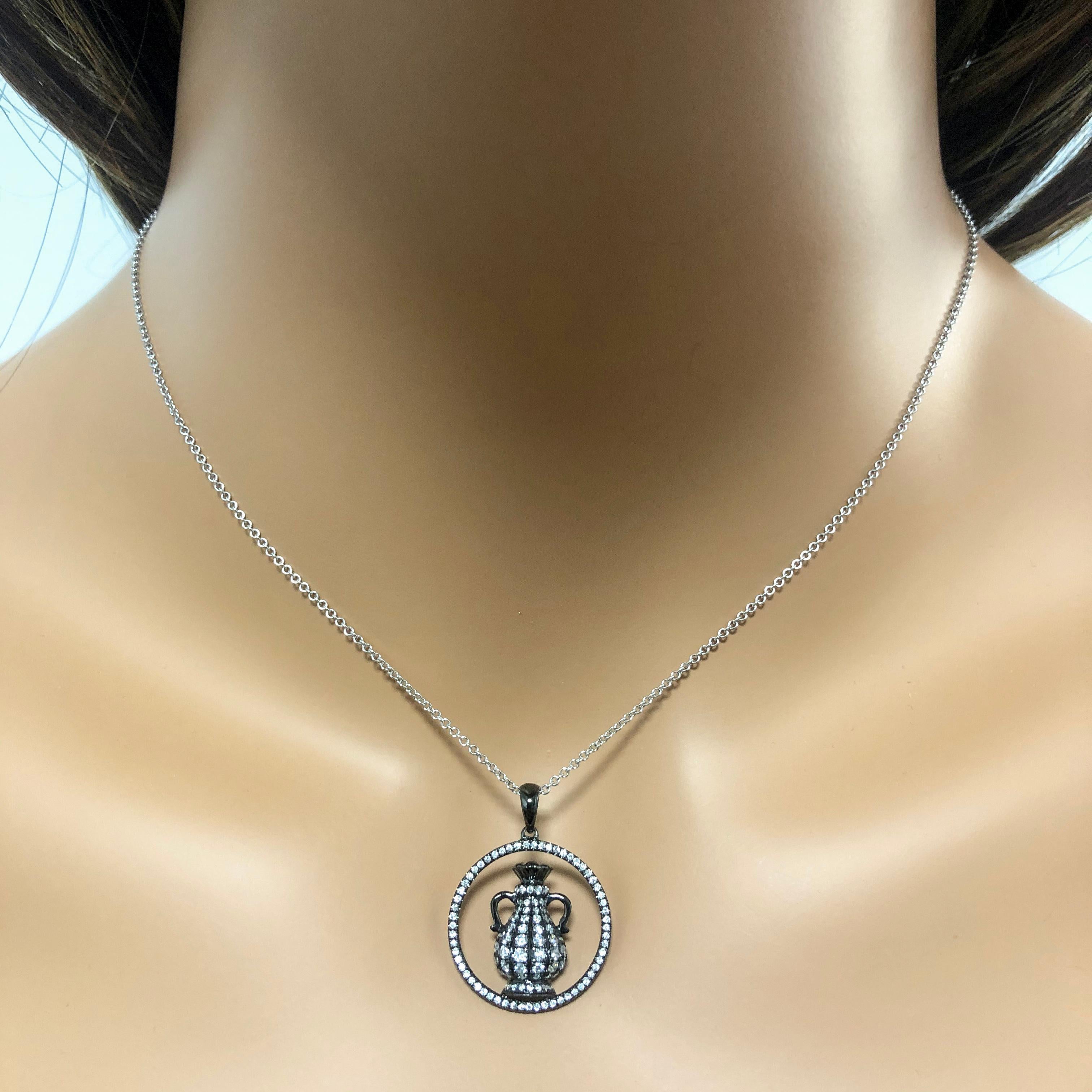 An elegant Aquarius zodiac necklace set with sparkling round diamonds weighing 0.56 carats total. Made with 18k gold, plated with black rhodium. Comes with 16 inch white gold chain. This is a perfect birthday gift for people who celebrate birthdays