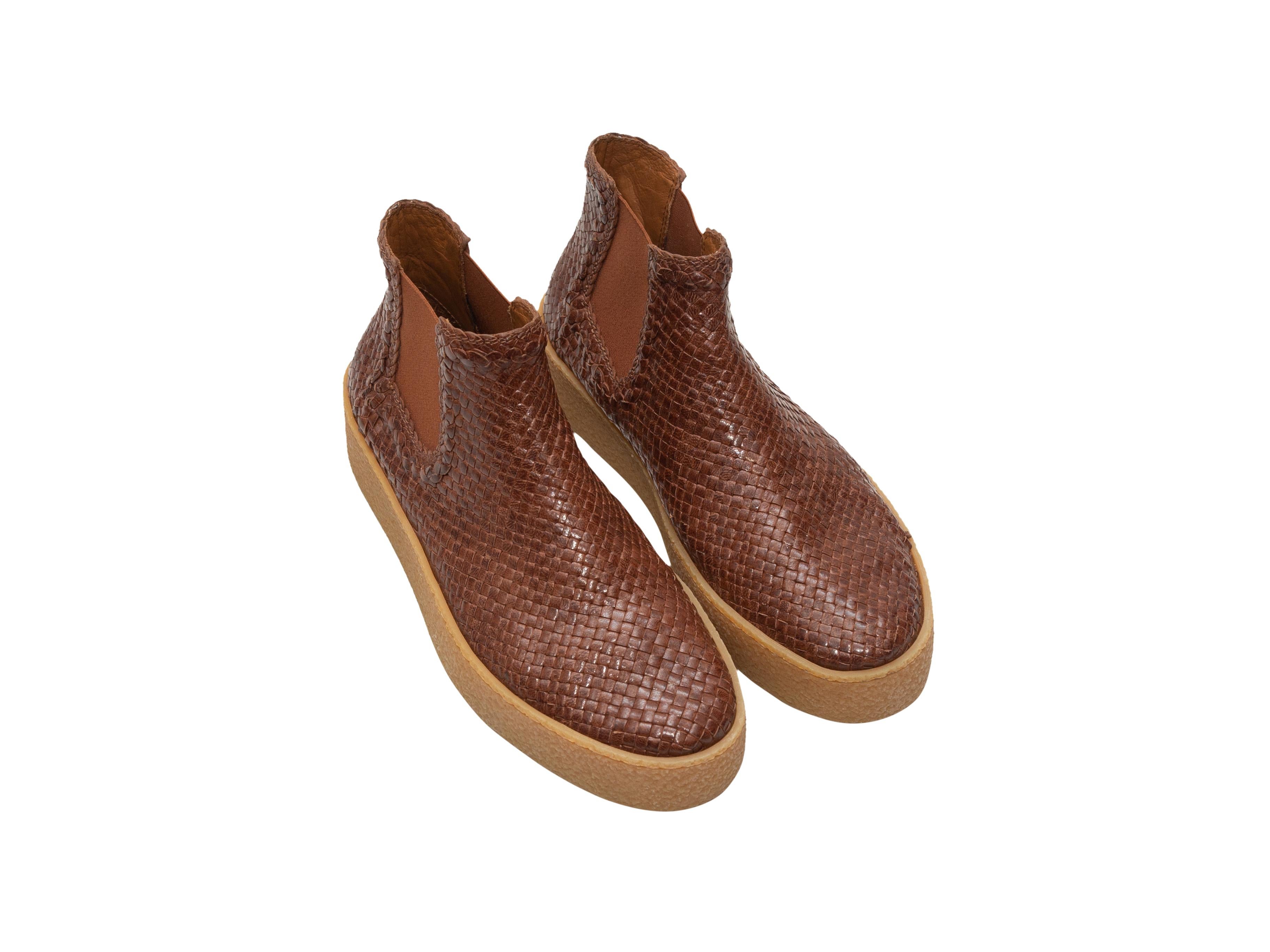 Product details: Brown woven leather platform ankle boots by Aquatalia. Elasticized gores at sides. Rubber soles. Designer size 39. 1.5