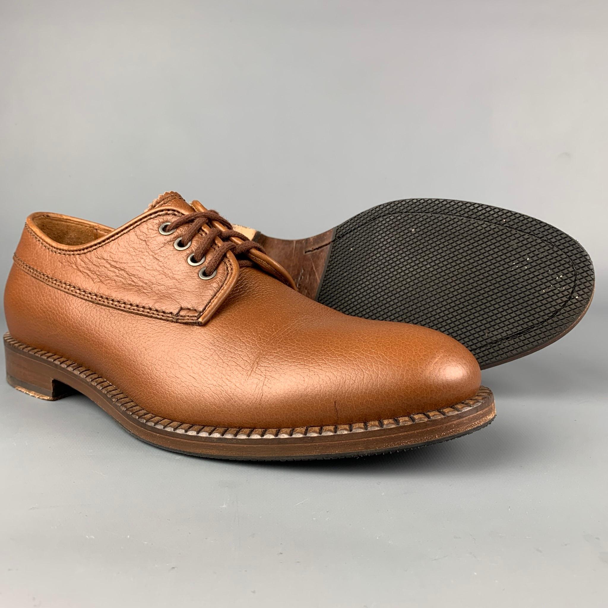 AQUATALIA shoes comes in a caramel leather featuring a cap toe, waterproof,  and a lace up closure. Made in Italy. 

Very Good Pre-Owned Condition.
Marked: 10.5 308719

Outsole: 12.5 in. x 4.5 in. 