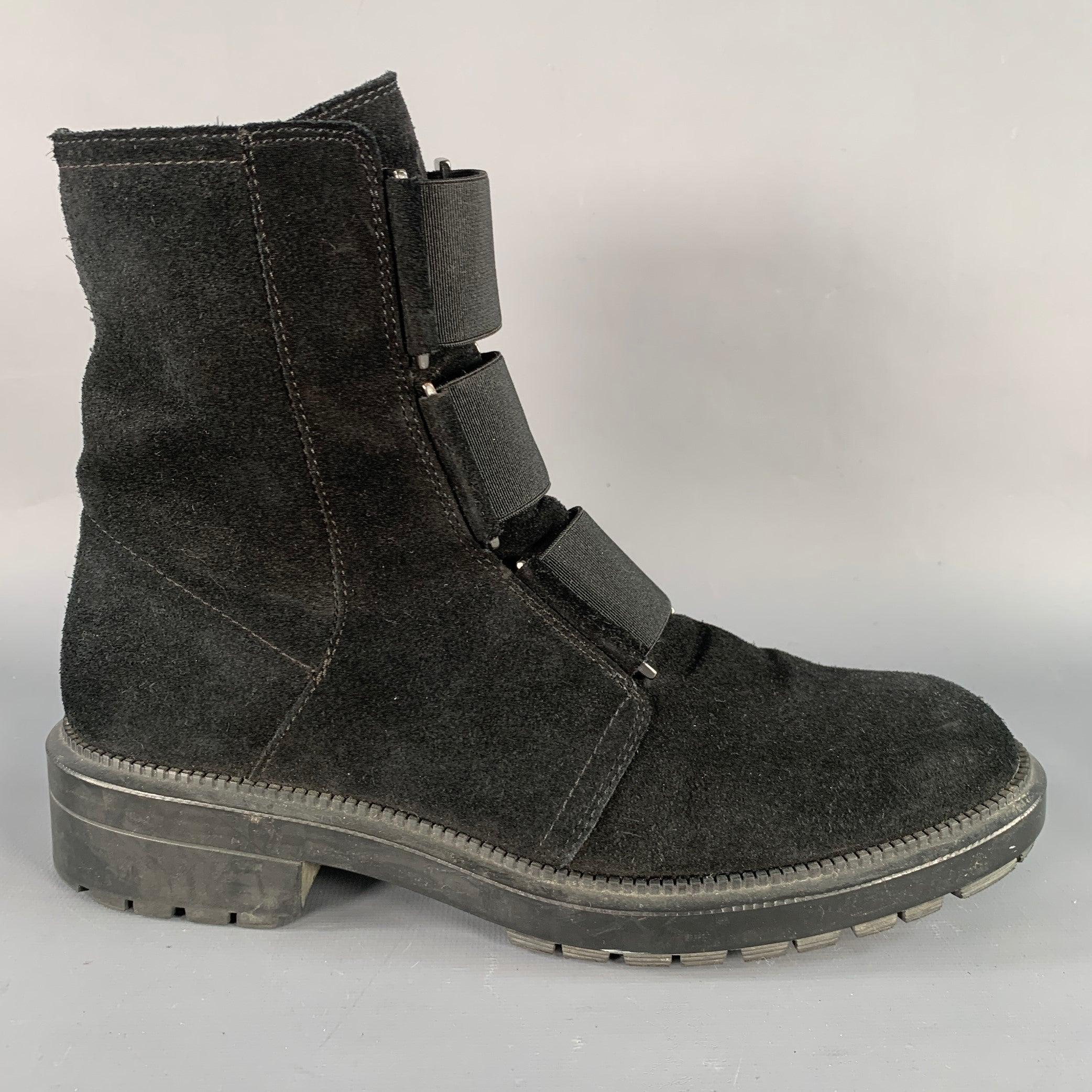 AQUATALIA boots
in a black suede featuring a tread sole, elastic panel details, and side zipper closure. Comes with dust bag. Made in Italy.Very Good Pre-Owned Condition. 

Marked:   7.5 

Measurements: 
  Length: 10.5 inches Width: 3.75 inches