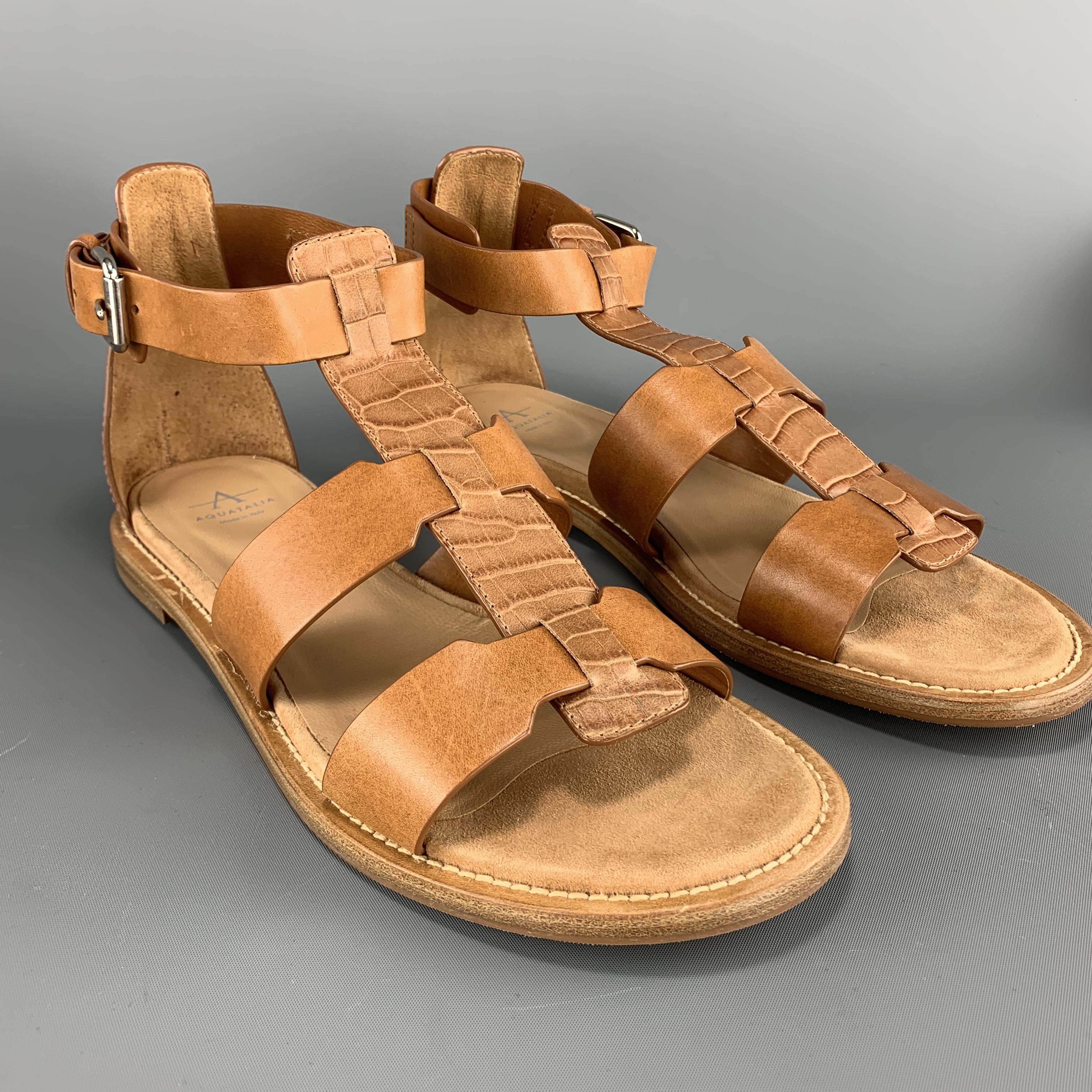 AQUATALIA gladiator sandals come in tan leather with smooth straps, and crocodile embossed T strap, and silver tone buckle. Made in Italy.

New with Box.
Marked: 9

Outsole: 10.75 x 4 in.