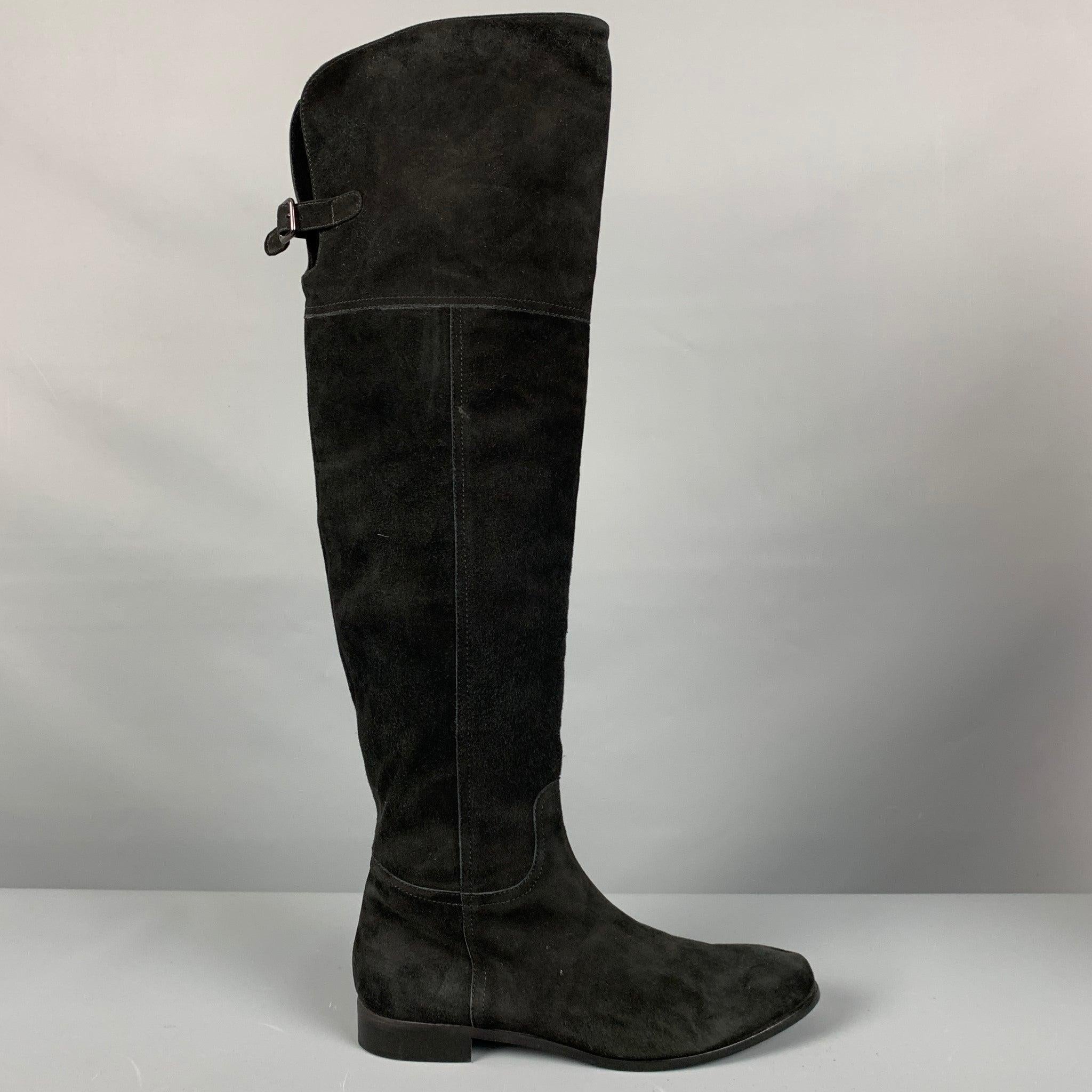 AQUATALIA
boots in a black suede featuring an over the knee style, buckle, and side zipper closure. Made in Italy.Very Good Pre-Owned Condition. Moderate signs of wear. 

Marked:   9.5 

Measurements: 
  Length: 11 inches Width: 3.5 inches Height: