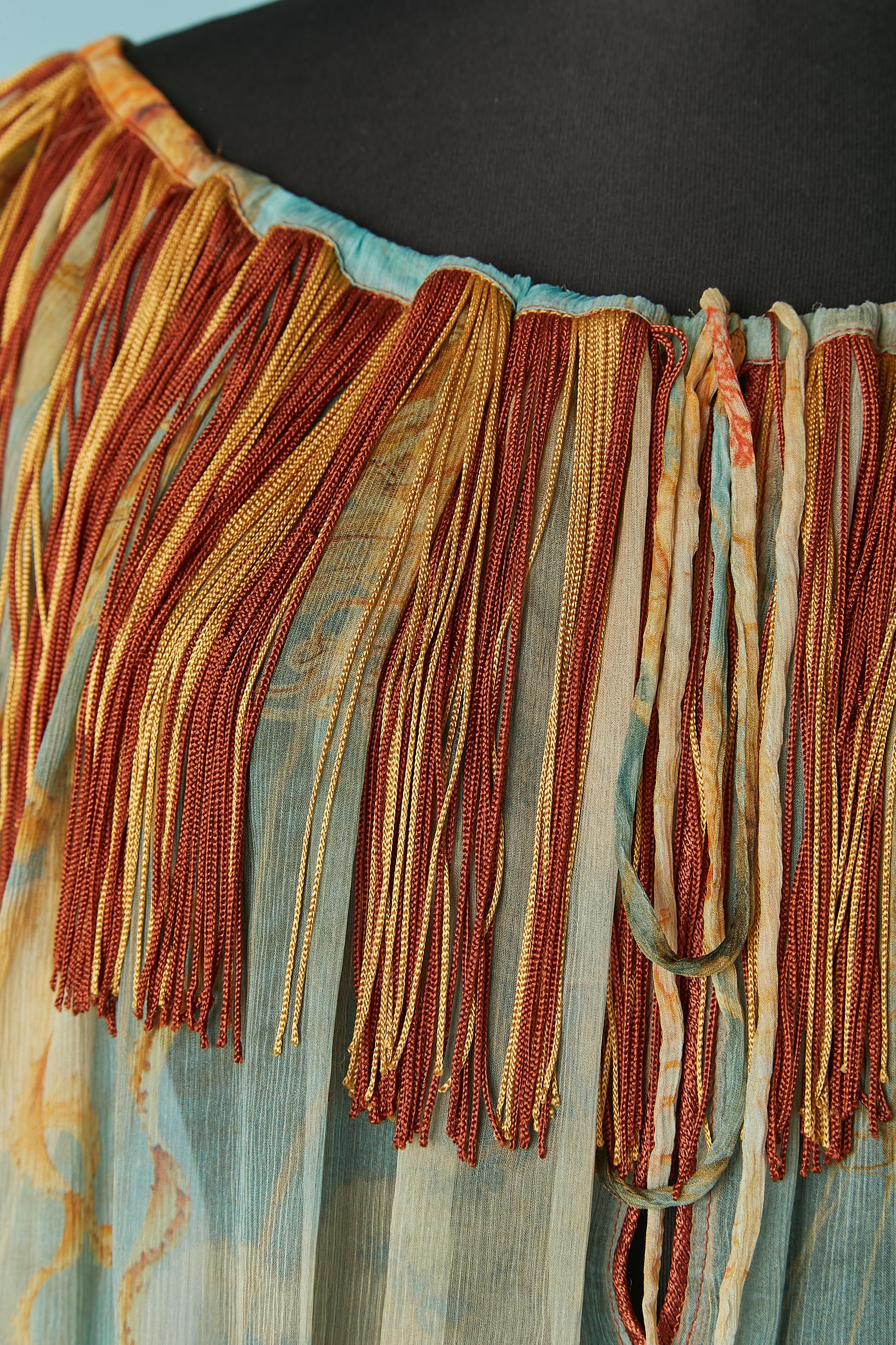 Printed silk chiffon blouse with fringes around the neckline. The fringes are probably in rayon thread. Bow in silk chiffon on the middle front. 
size 44 (It) 10 (Us) L 