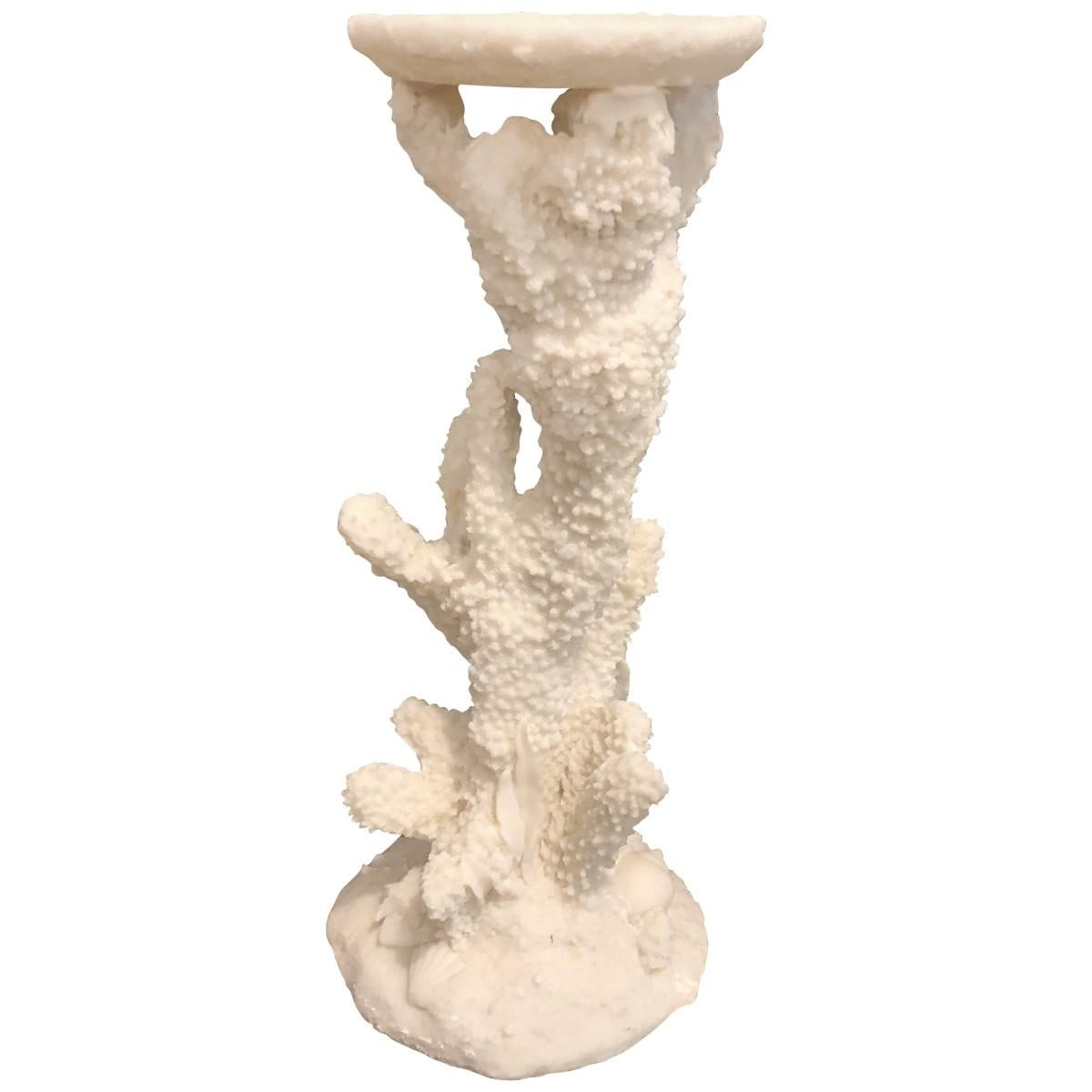 Eclectic design derives ideas, style, or taste from a broad and diverse range of sources. Done in an aquatic theme, these carved candlesticks are a distinctive set. Their coral-form stems are decorated with shells and aquatic plant life for a unique