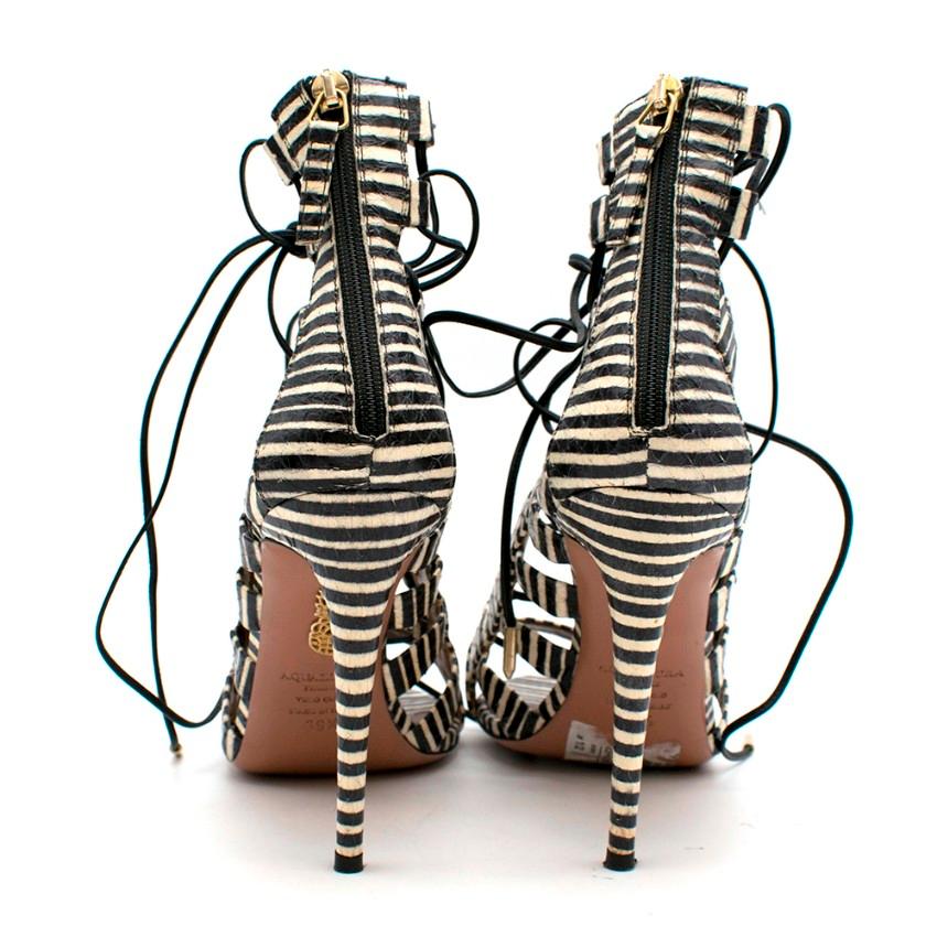 Aquazzura Black & White Striped Lace-Up Peep-toe heel 

- Zip Closure to back 
- Peep-Toe 
- Full Lace-up front 
- Black Laces 
- Stiletto Heel 
- Tan Leather Interior 
- Rounded Toe 

Made in Italy 

Please note, these items are pre-owned and may