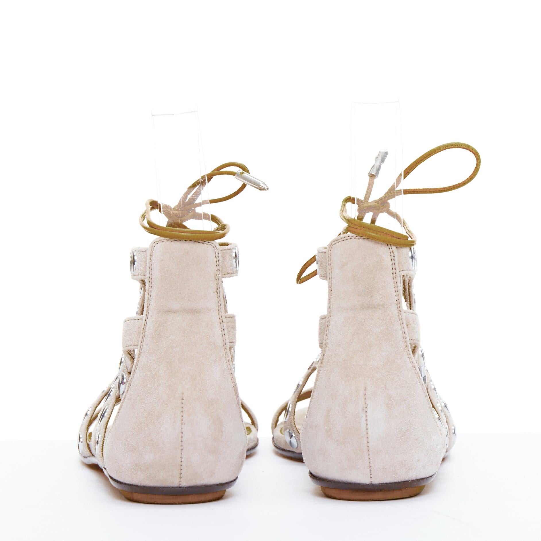 Donna AQUAZZURA sandali gladiatore in pelle beige con borchie a forma di disco d'argento EU36 in vendita