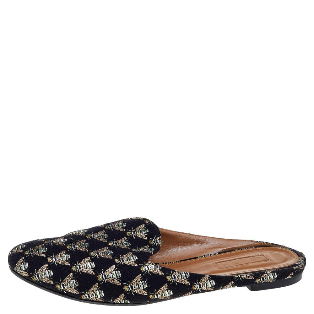 Treat your feet to the best of things by choosing these flat mules from Aquazzura! They are crafted from fabric and designed with round toes and bee embroidery all over. The mules are high in both style and comfort.

