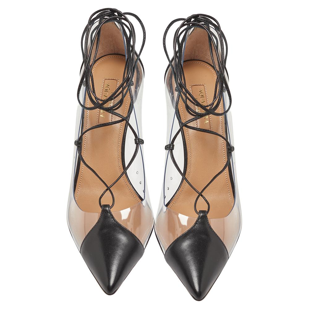 You're sure to win hearts with these chic pumps from Aquazzura. In a fabulous black exterior made from leather & PVC, the Magic pumps carry pointed toes, lace-up detailing forming ankle wraps, 8.5 cm heels and comfortable leather insoles.

Includes:
