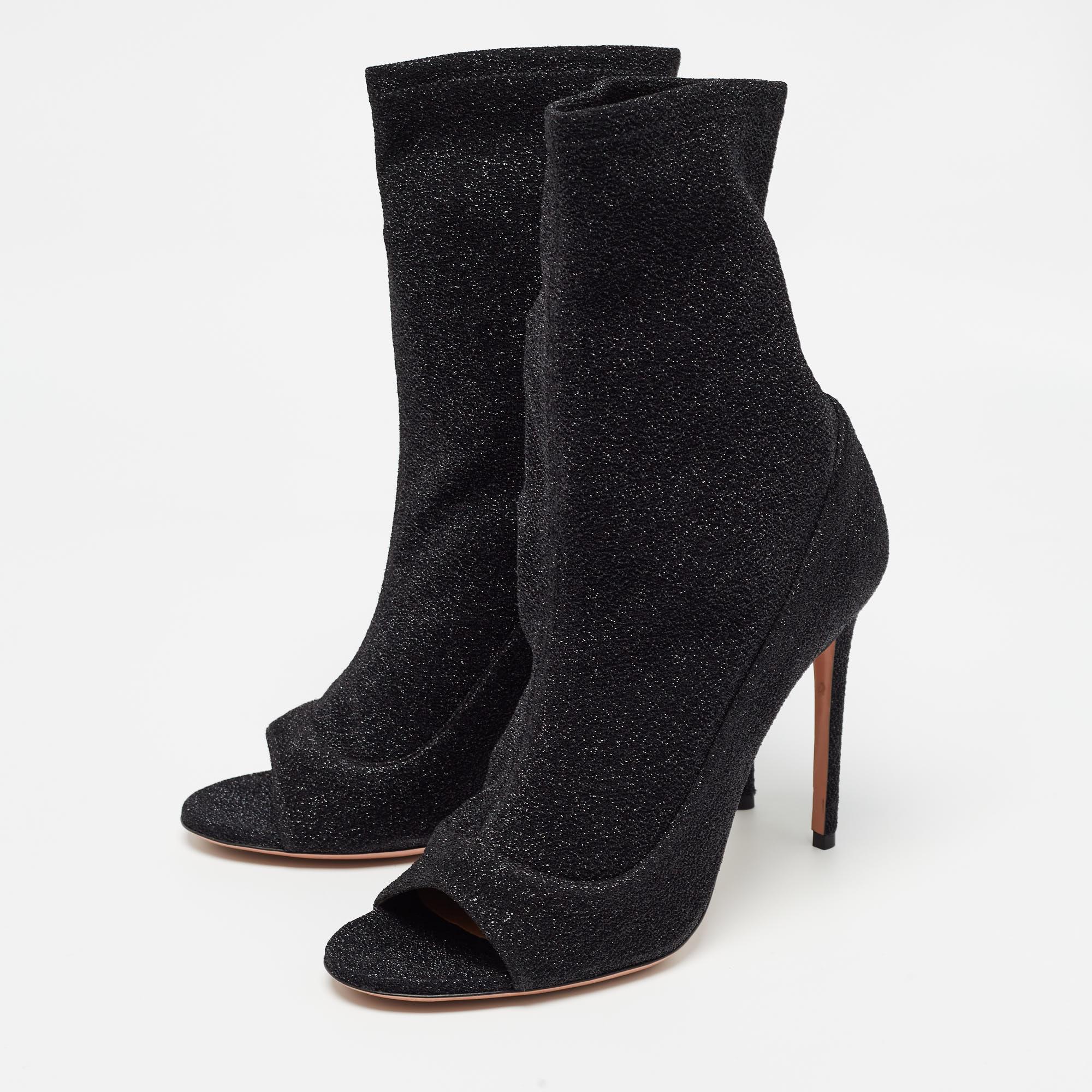 If the quest is for a pair of statement boots, we'll gladly choose this one by Aquazzura. The women's boots are crafted from lurex fabric and have open toes and sleek heels.