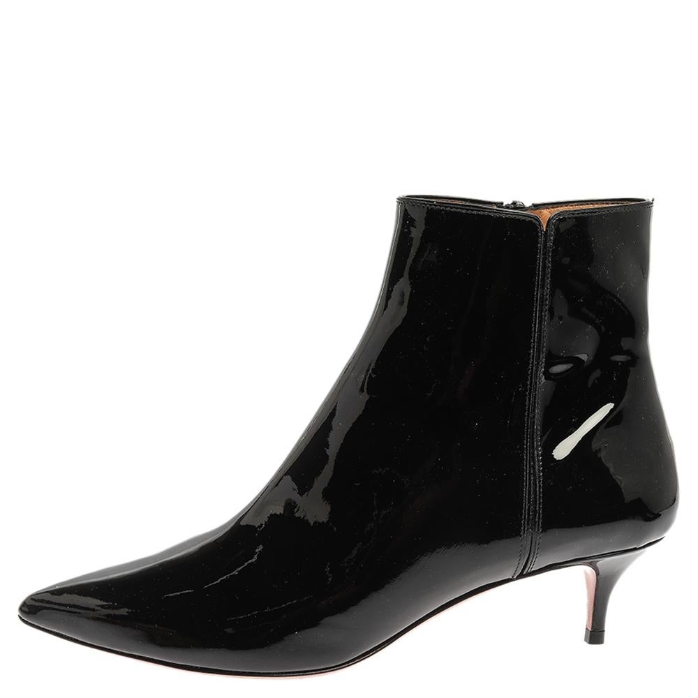 Purposely built to make you feel like a fashion diva, these Aquazzura booties are not to be missed. The black beauties are crafted from patent leather and feature a pointed-toe silhouette. They come equipped with comfortable leather-lined insoles,