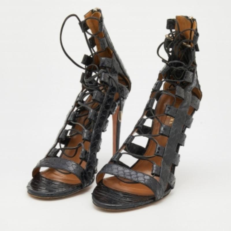 Aquazzura brings you these sandals to elevate your style sense and attire! They are created using python leather and feature lace-up detailing on their vamps. They have open toes, zipped counters, and 11 cm heels. Look super trendy and chic as you