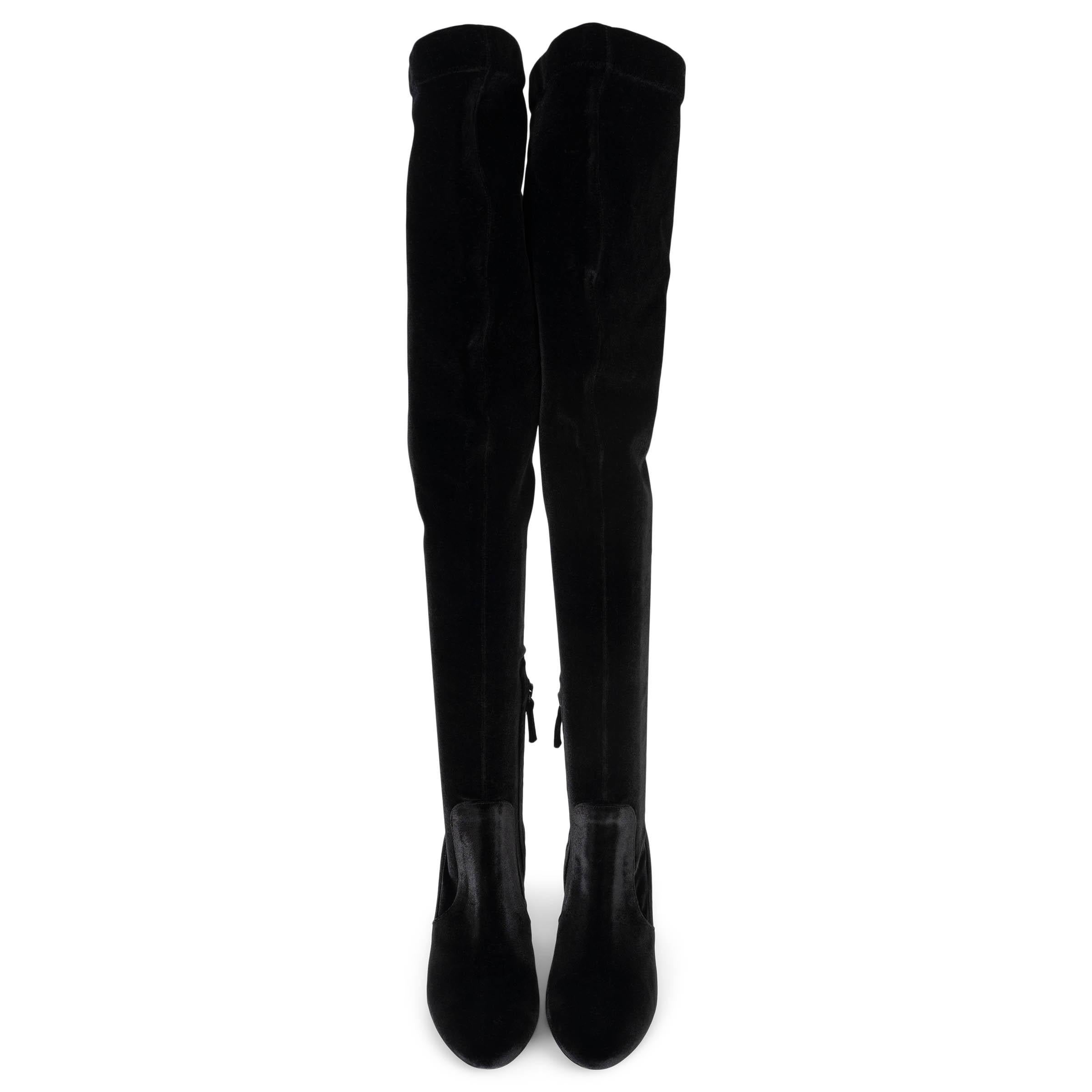 These 100% authentic Aquazzura So Me boots are a stunning statement piece, crafted from luxurious black velvet. Designed as thigh-high, over-the-knee boots, they feature an 85mm heel and a sleek zip closure for a secure and elegant fit. Perfect for