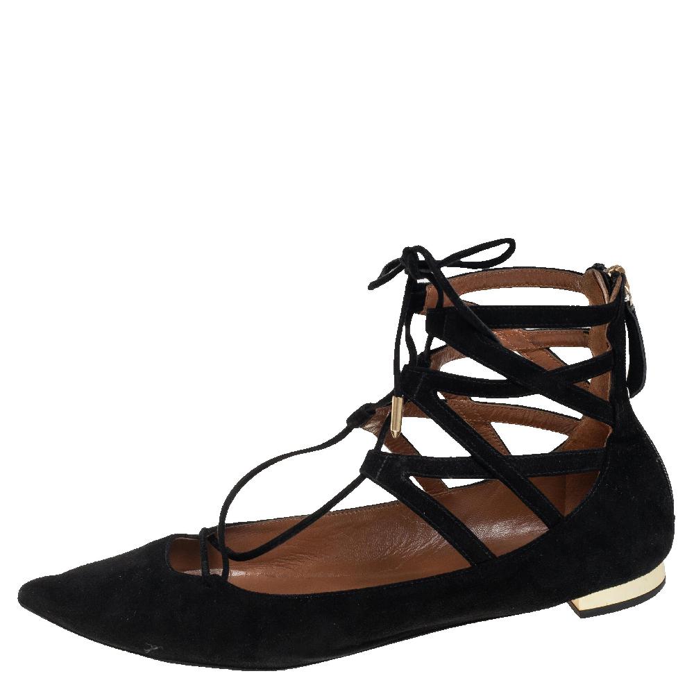 Beautiful and sophisticated, these lace-up flats from Aquazzura are a perfect alternative to your party heels. Rendered in black suede, the pair is styled with round toes and crisscross laces that are meant to frame your foot. Complete with low