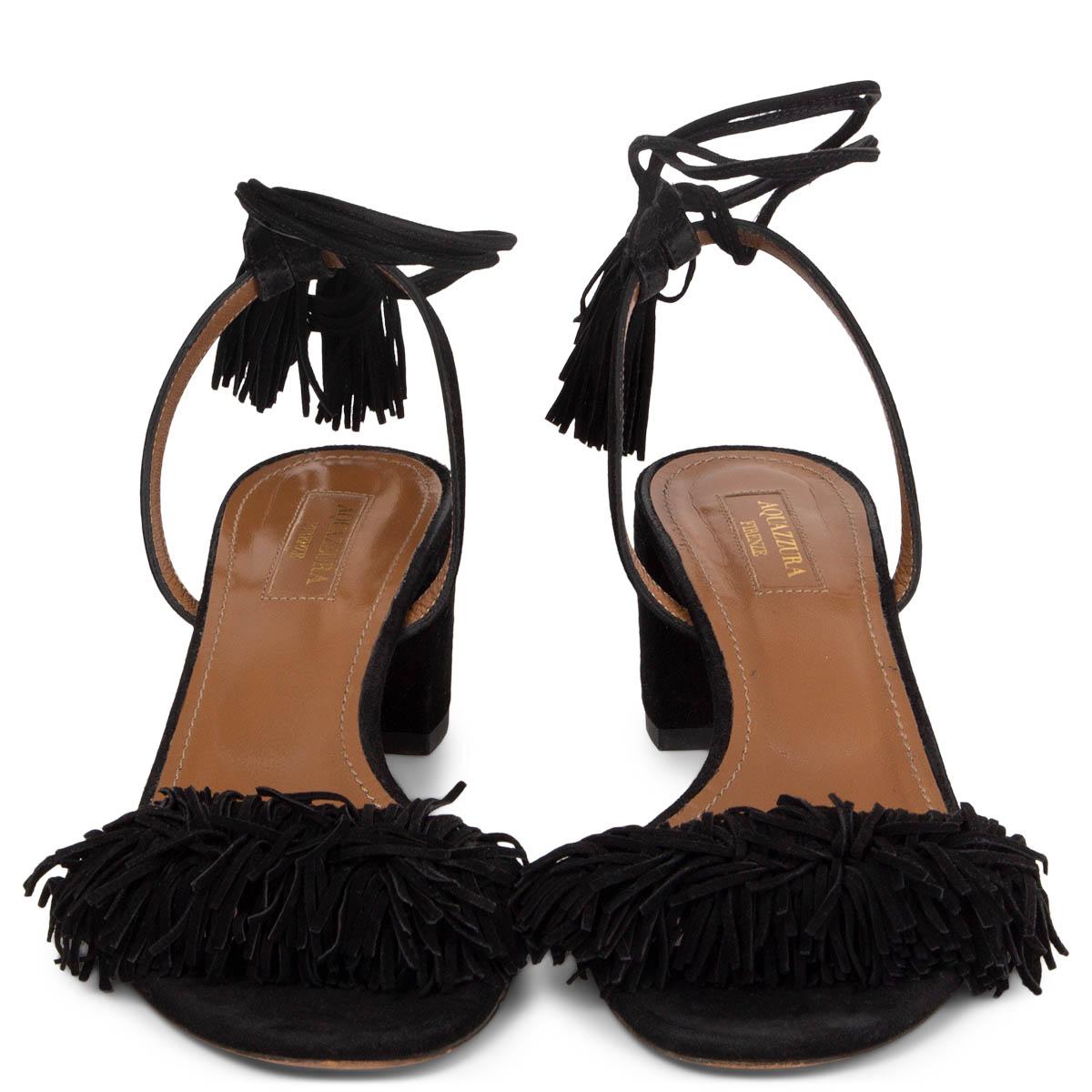 100% authentic Aquazzura Wild Thing Sandals in black suede with block heel and ankle-strap. Have been worn and are in excellent condition. 

Measurements
Imprinted Size	37
Shoe Size	37
Inside Sole	24cm (9.4in)
Width	7.5cm (2.9in)
Heel	5.5cm