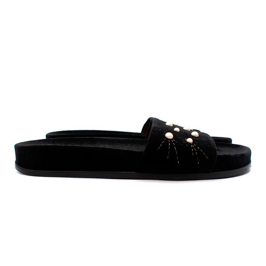  Aquazzura Black Velvet Faux-Pearl Embellished Strap Slippers
 

 - Black slippers with velvet upper and outsole
 - Wide strap embellished with faux-pearls and gold-tone thread
 - Set on a platform
 

 Materials:
 Synthetic
 Leather
 

 Made in