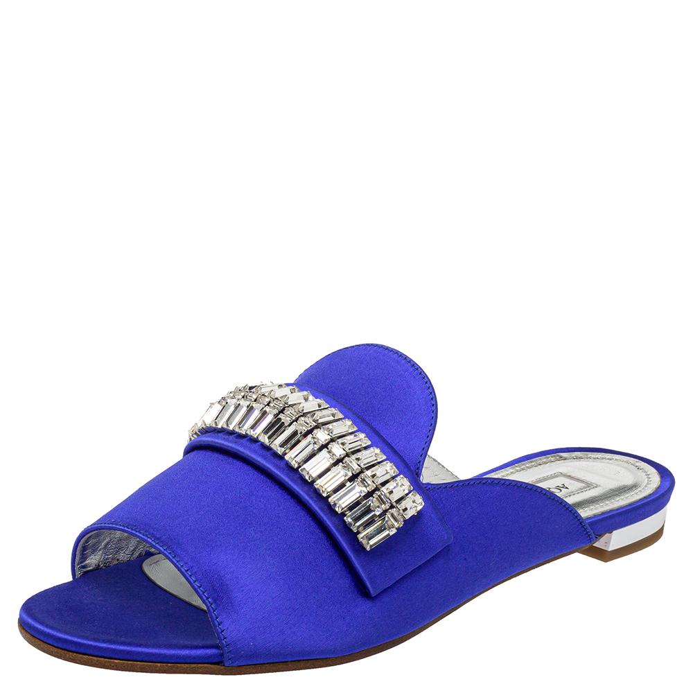 The perfect complement to eveningwear or casuals, Aquazzura's Winston sandal is crowned with crystals on the uppers for a sparkly effect accompanying every step you take. The blue satin slide sandals are lined with leather and set atop low