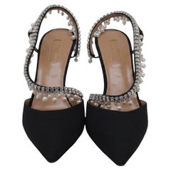 Decolleté con cinturino posteriore decorato di Aquazzura in raso nero