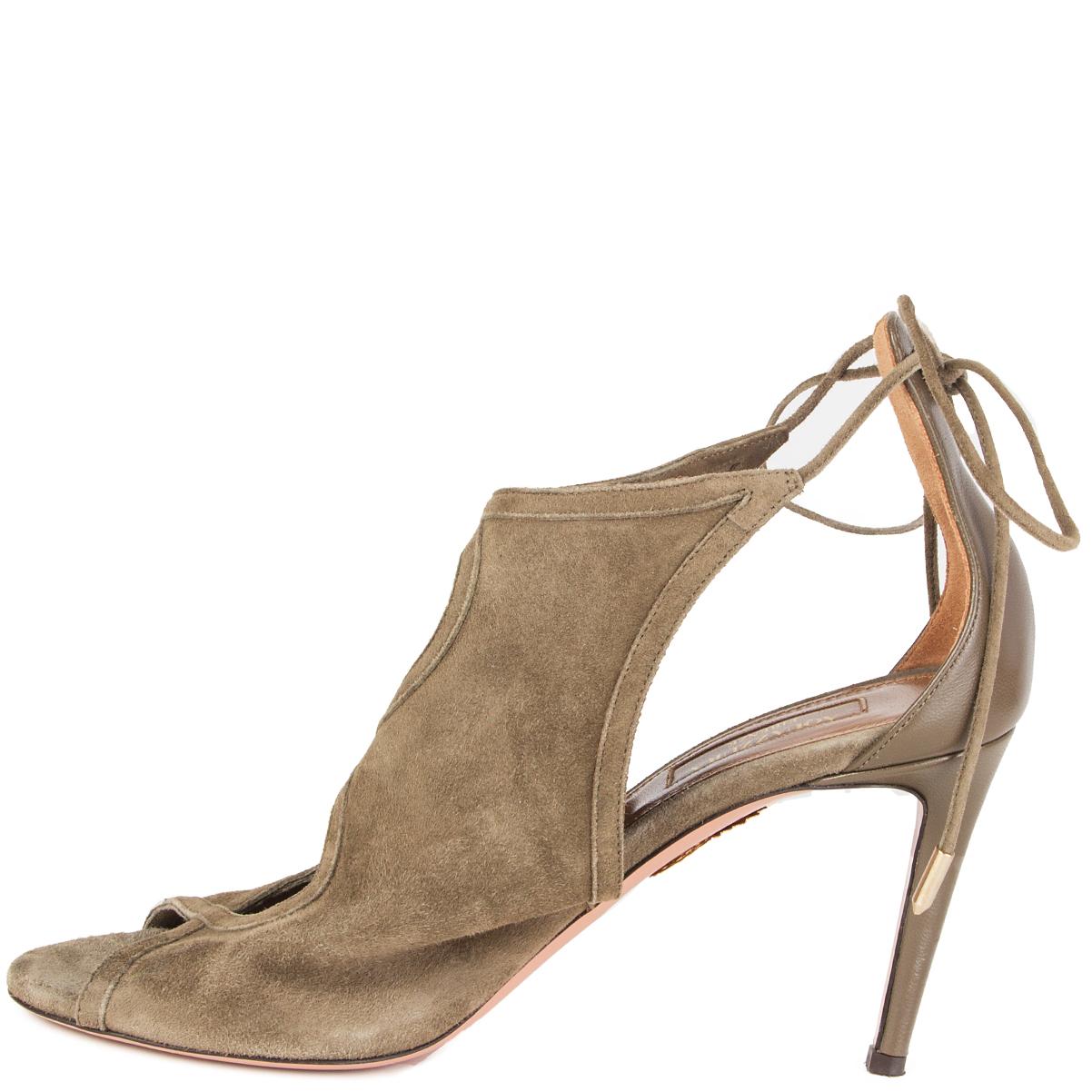 100% authentische Aquazzura 'Nomad Sandal 85' Sandalen aus khakigrünem Wildleder und Kalbsleder. Um den Knöchel binden. Sie wurden getragen und sind in ausgezeichnetem Zustand. 

Messungen
Aufgedruckte Größe	37.5
Schuhgröße	37.5
Innensohle	24,5 cm