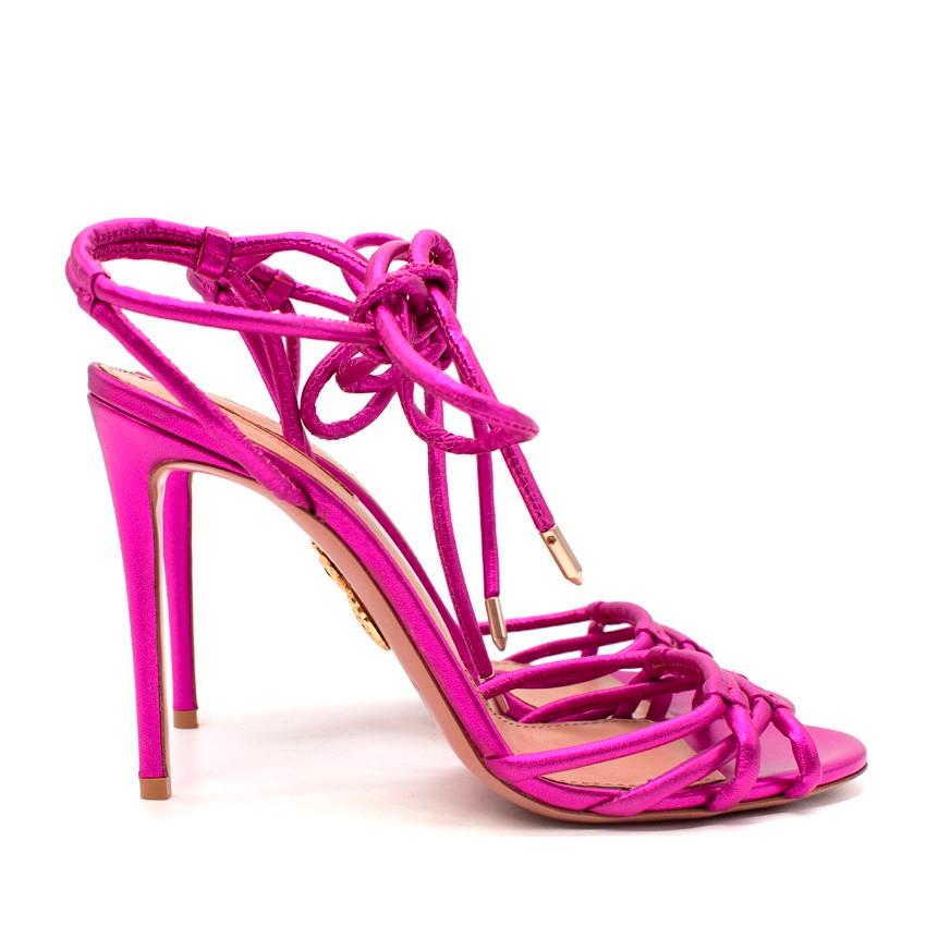  Aquazzura Laura Metallic Pink Leather Heeled Sandals
 

 - Metallic pink leather 4 straps to the round toe
 - Rounded straps wrap around the ankle
 - Set on a stiletto heel 
 

 Materials:
 Leather
 

 Made in Italy
 

 PLEASE NOTE, THESE ITEMS ARE