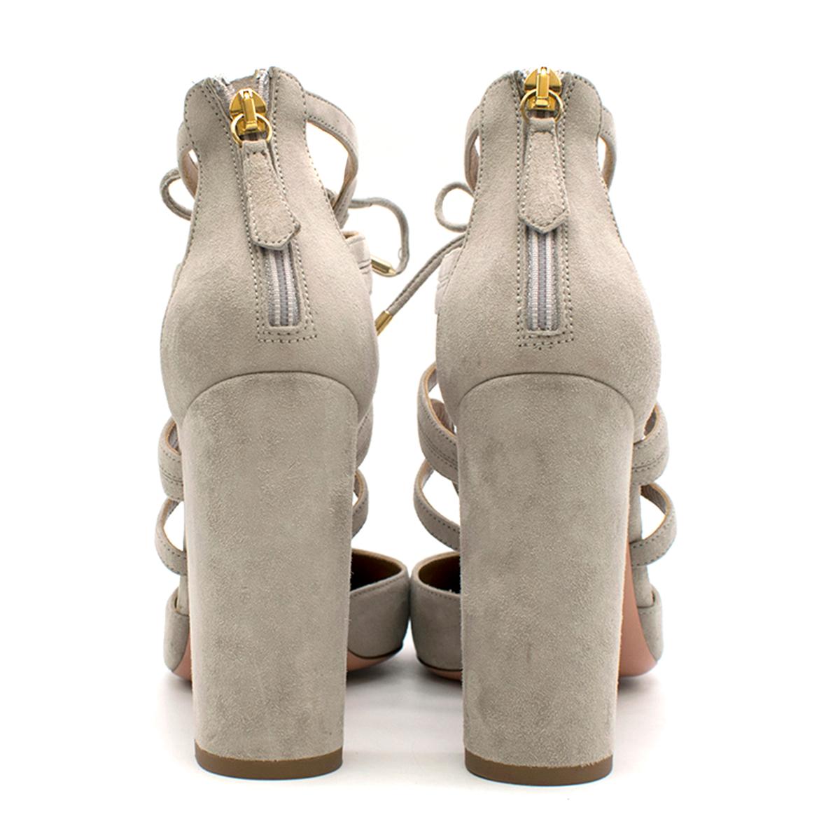 Aquazzura Light Grey Suede Tie-up Heel 

-Light grey, suede
-Round-toe
-Block heel style
-Zip up heel panel 
-Tie-up closure 
-Gold accents 
-Signature gold pineapple on sole

Please note, these items are pre-owned and may show some signs of