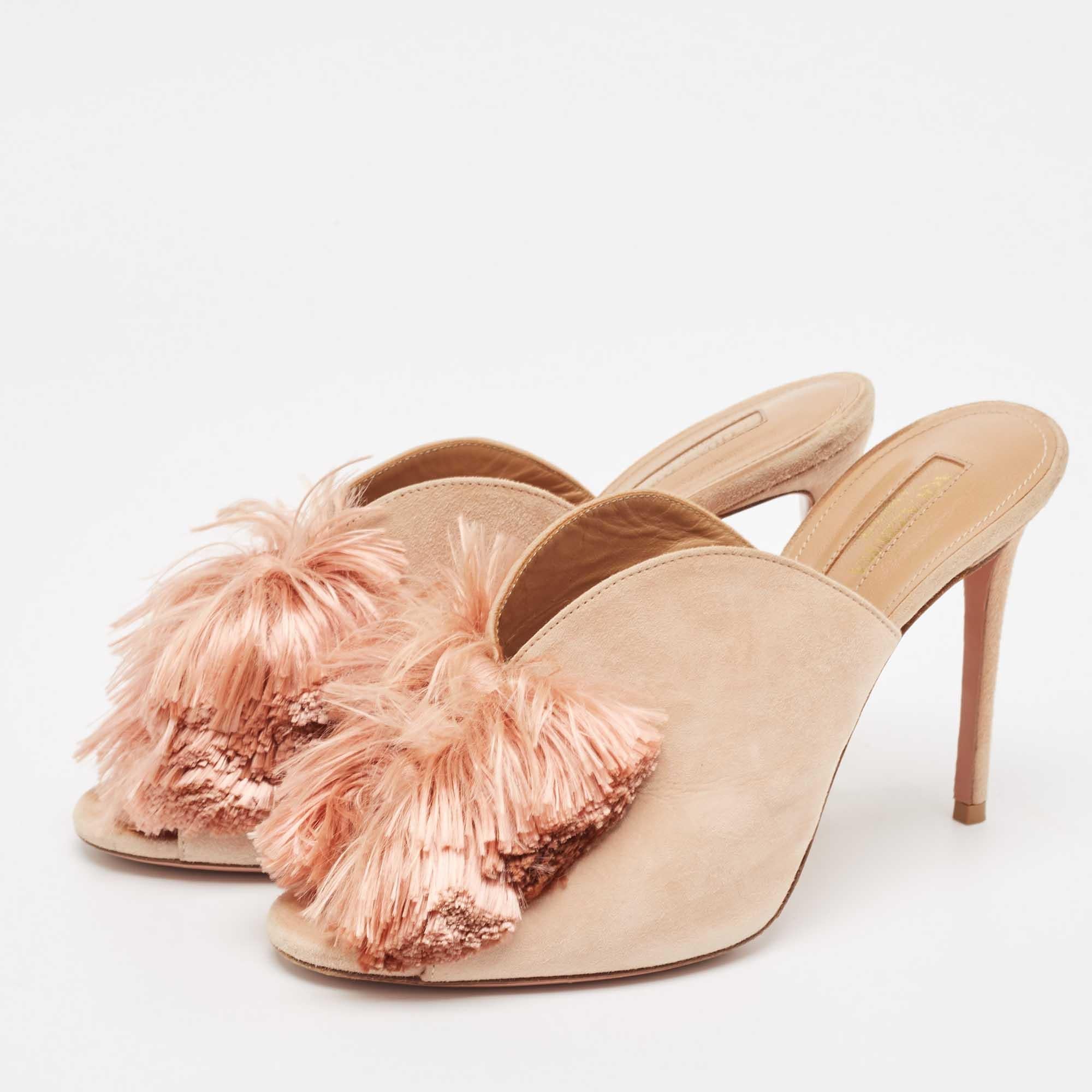 These Aquazzura Lotus Blossom mules bring joy to ones eyes. They are made from suede and designed with peep toes three fringed bows on the vamps and high stiletto heels. The pair is simply beautiful