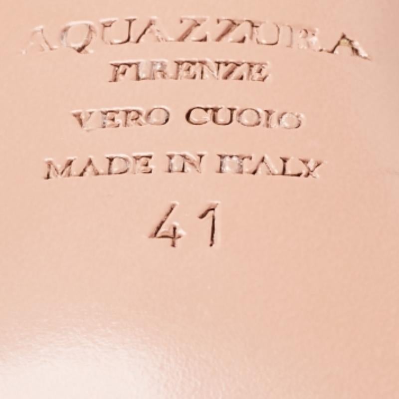 The house of Aquazzura brings you these impressive sandals that will complement any outfit. These sandals are crafted in Italy and are made from python-embossed leather. These strappy sandals are styled with a thin front strap, extended counters