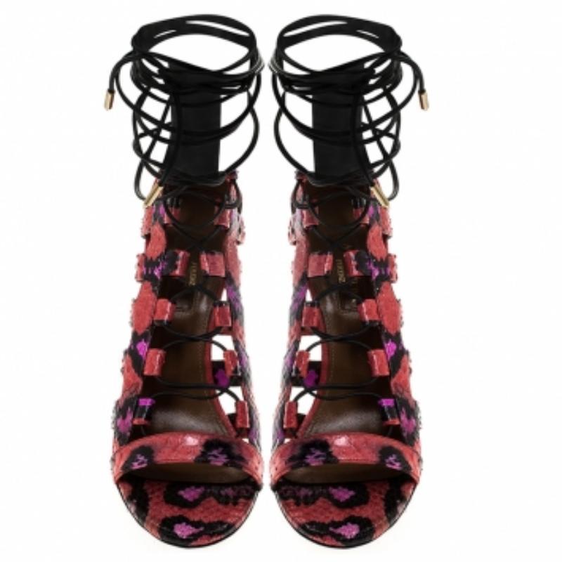 These sandals from Aquazzura look absolutely breathtaking! The sandals are crafted from python leather and designed in a strappy layout with cutouts, rear zippers and tie-ups. Balanced on 10.5 cm heels, this lovely pair will have everyone in