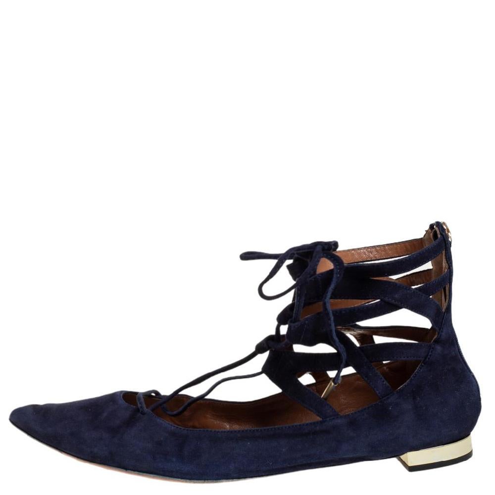 Beautiful and sophisticated, these lace-Up ballet flats from Aquazzura are a perfect alternative to your party heels. Rendered in navy blue suede, the pair is styled with pointed toes and crisscross laces that are meant to be tied around the ankle.