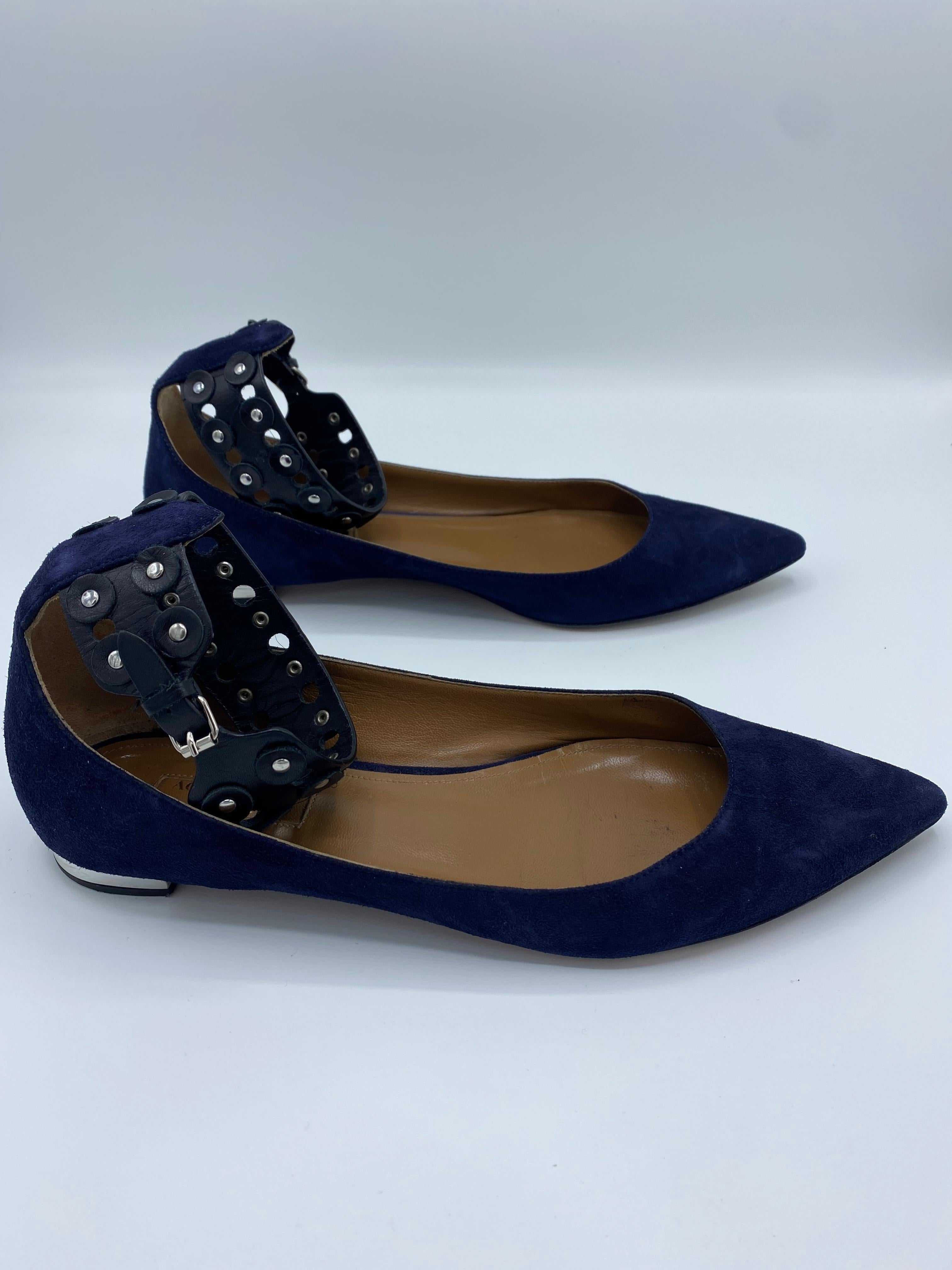 Product details:

The flats feature navy suede, black leather, silver tone hardware and buckled closure. 
Est. Retail $695.
Made in Italy.