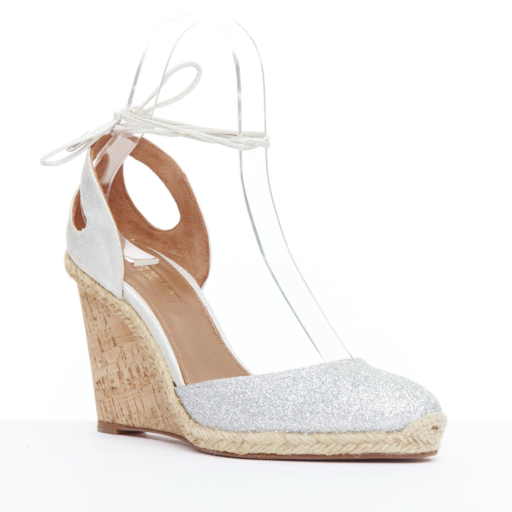 AQUAZZURA Palm Beach metallic glitter cork wedge sandals EU39
Reference: JHDN/A00030
Brand: Aquazzura
Model: Palm Beach
Material: Leather, Cork
Color: Silver, Nude
Pattern: Solid
Closure: Ankle Tie
Lining: Brown Leather
Extra Details: Metallic