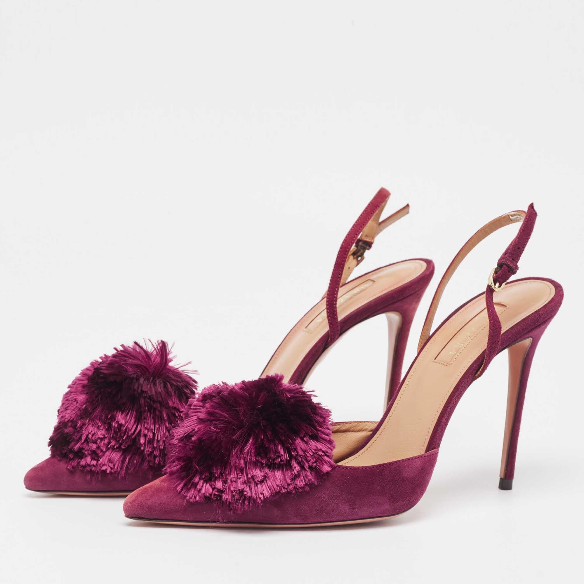 Treat your feet to this gorgeous pair of Powder Puff sandals from Aquazzura. Crafted from plum suede, this pair features pointed toes, sleek 10.5cm heels, and buckle slingbacks. The insoles are lined with leather and the pair is complete with pompom