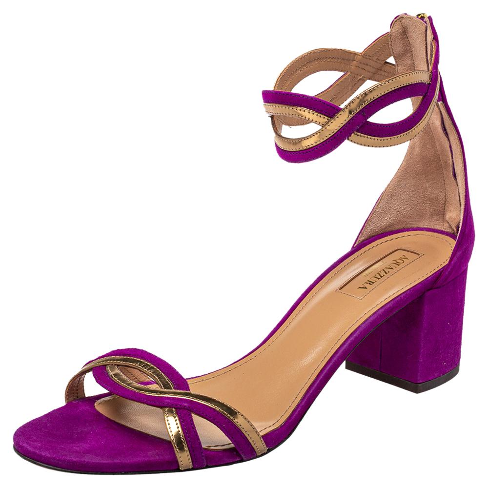 Feel elegant in this pair from the house of Aquazzura. These purple and gold sandals featuring gorgeous straps will frame your feet in a lovely way. They are secured with zippers and lifted on block heels.

