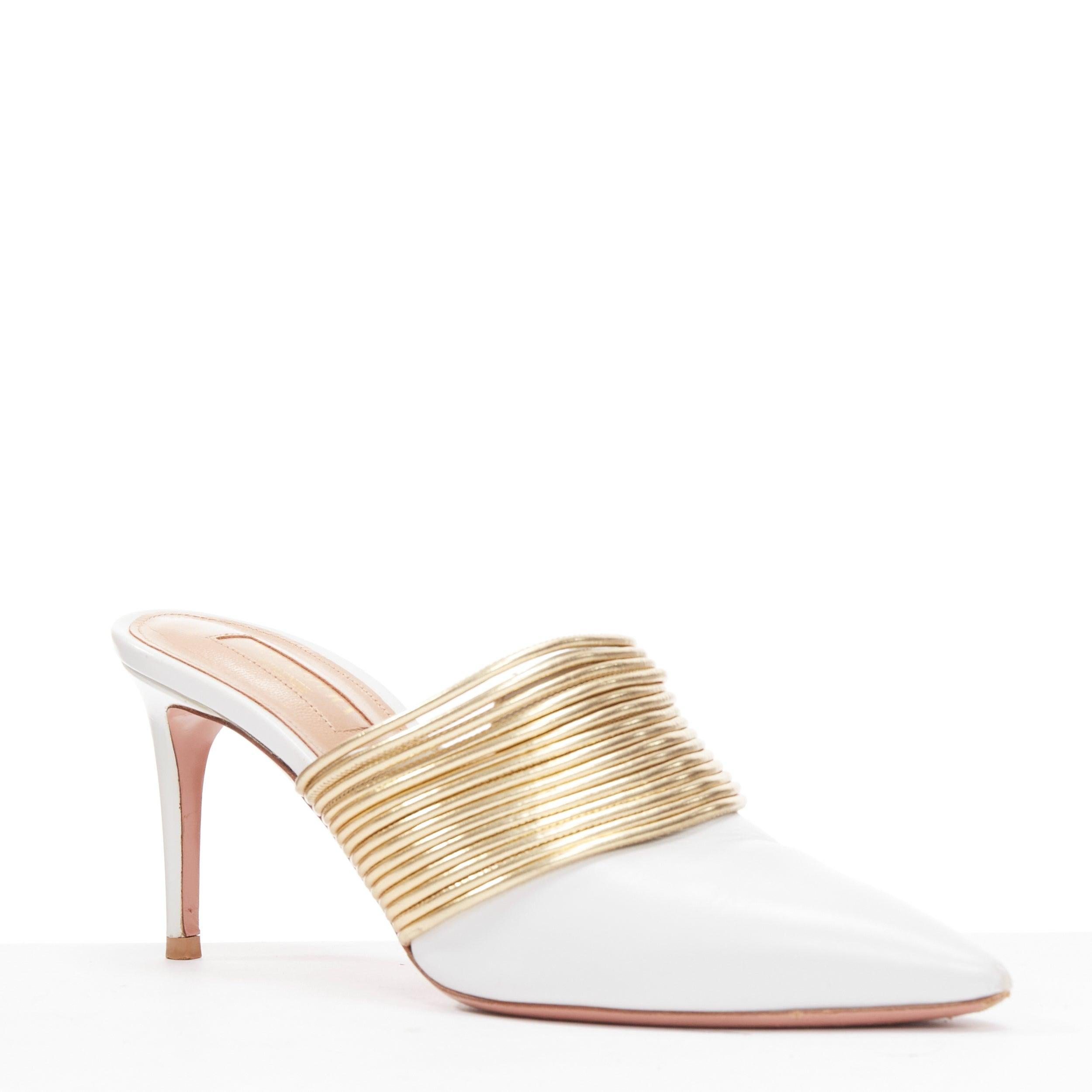 AQUAZZURA Rendez Vous 75 white leather gold coil mule pumps EU36
Reference: EALU/A00045
Brand: Aquazzura
Model: Rendez Vous 75
Material: Leather
Color: White, Gold
Pattern: Solid
Closure: Slip On
Lining: Nude Leather
Extra Details: Stilleto