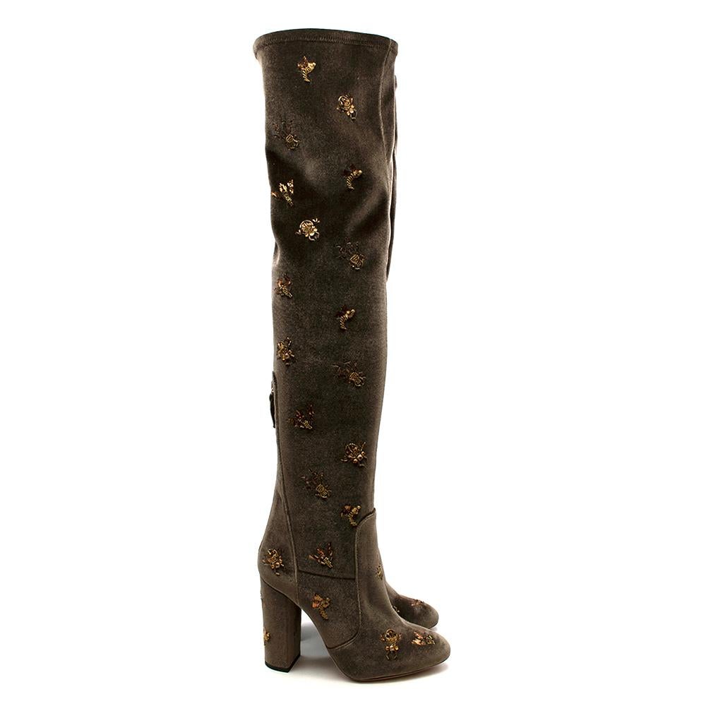 Aquazzura Taupe Velvet Gold Embroidered Thigh High Boots

-Beautiful golden embroidery depicting insect 
-Luxurious stretchy velvet for the best fit 
-Zip fastening to the back for practicality 
-Chunky heel for stability 
-Iconic pineapple golden
