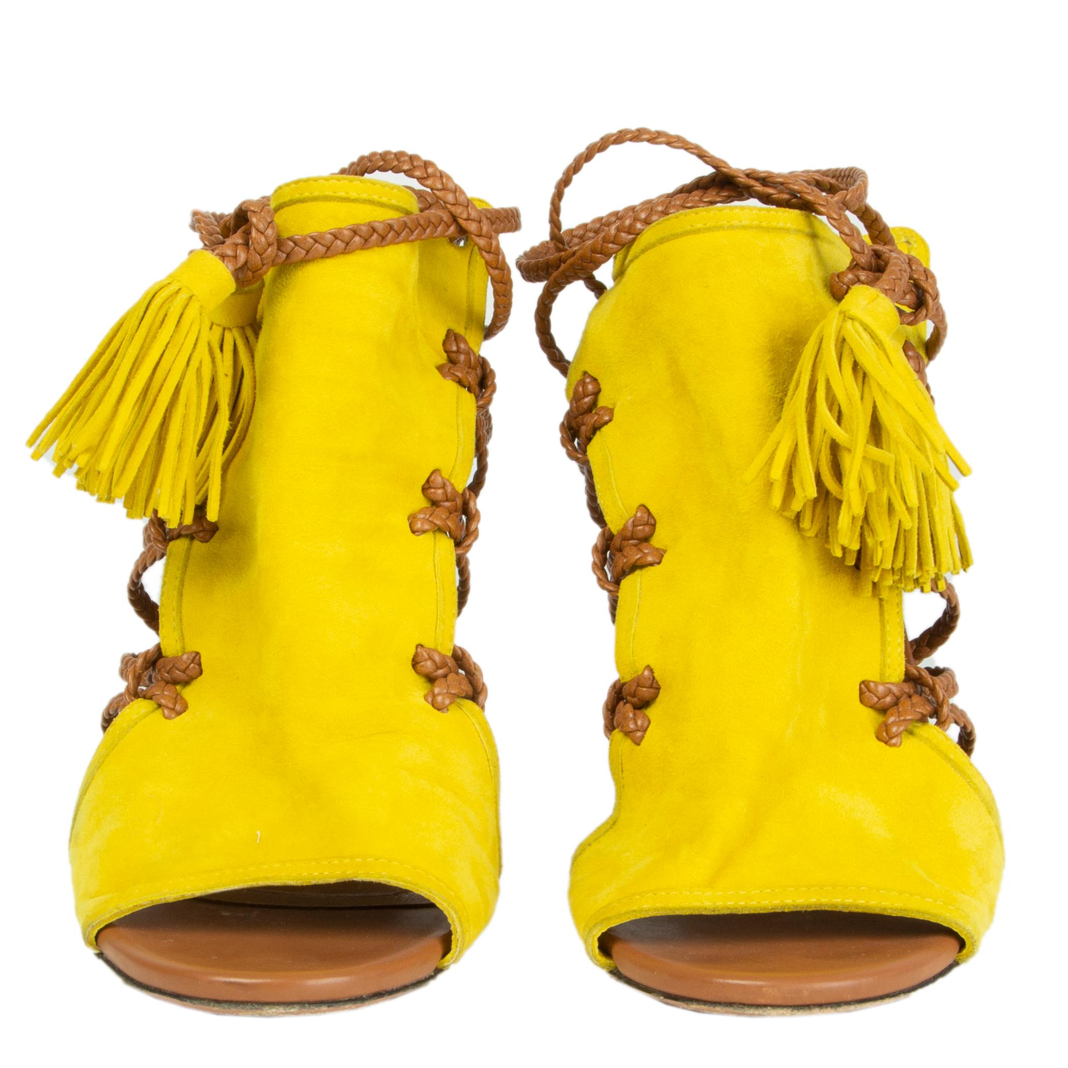 100% authentic Aquazzura 'Sahara' braided lace sandals in yellow suede and dark camel calfskin. Have been worn and are in excellent condition. 

Measurements
Imprinted Size	38
Shoe Size	38
Inside Sole	24.5cm (9.6in)
Width	7.5cm (2.9in)
Heel	11.5cm