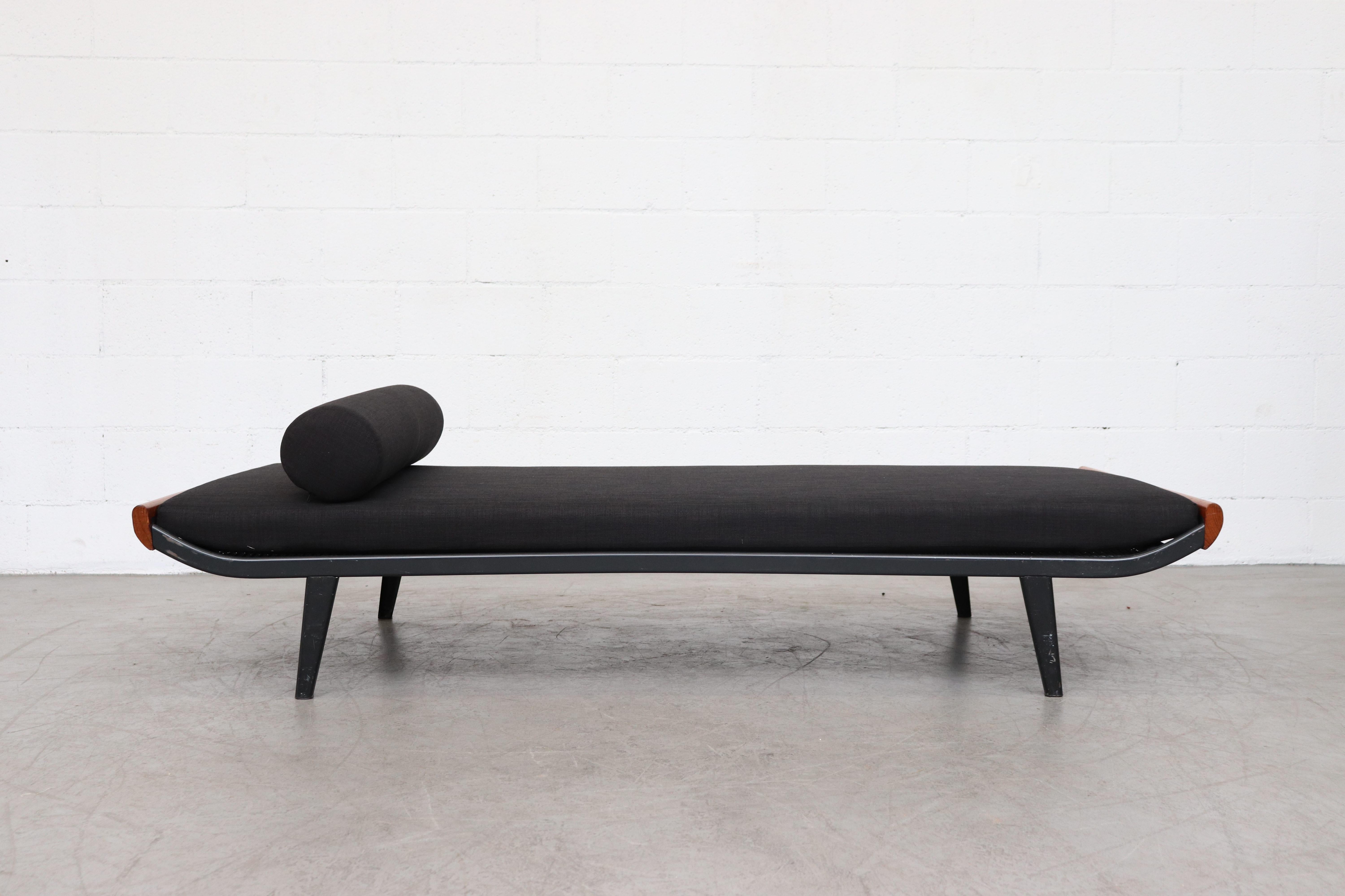 1960s Cleopatra day bed by A.R. Cordemeyer. Teak wood ends with enameled dark grey, almost black enameled metal frame and 
