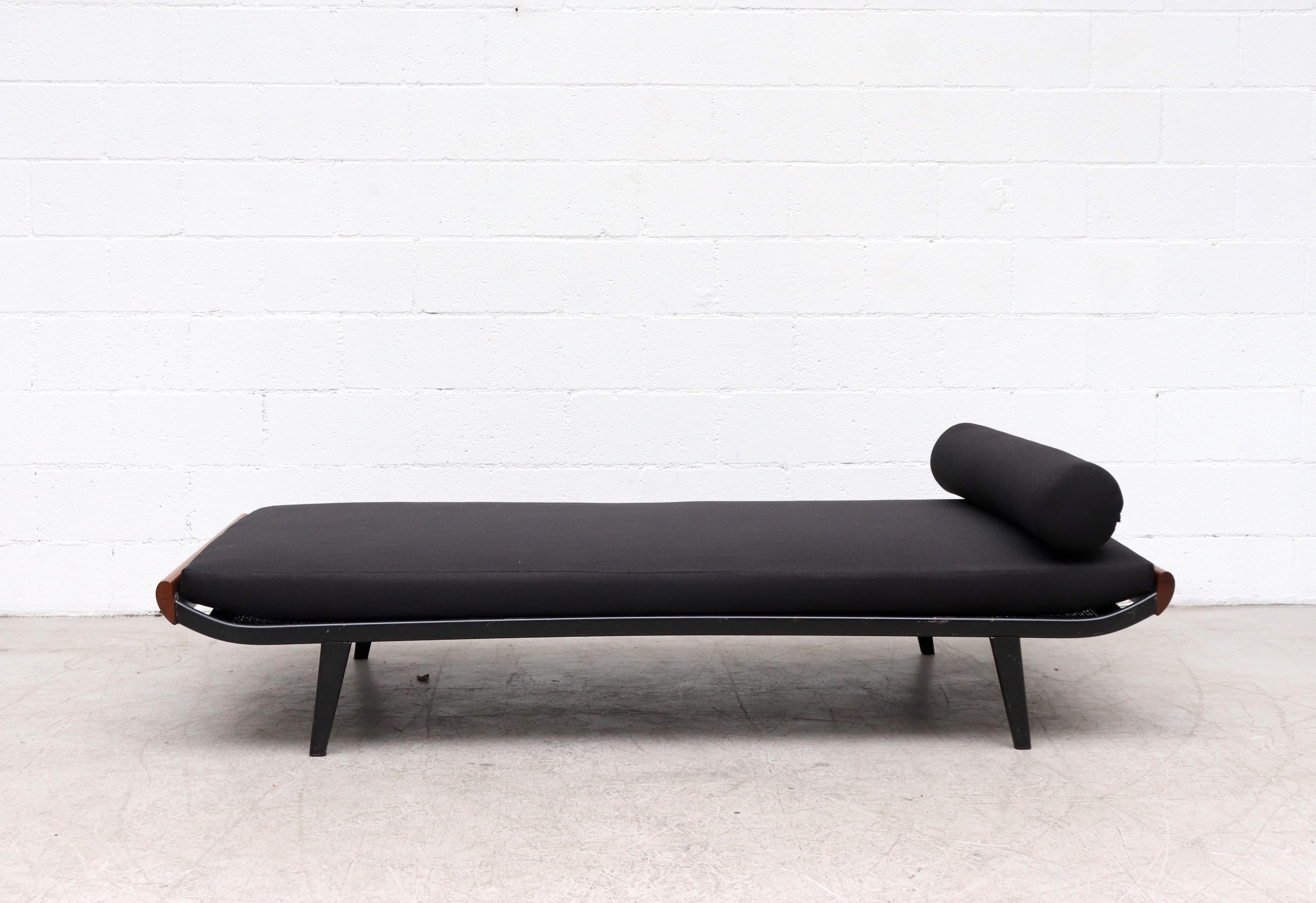 1960s Cleopatra daybed by A.R. Cordemeyer. Teak wood ends with dark grey enameled metal frame and 