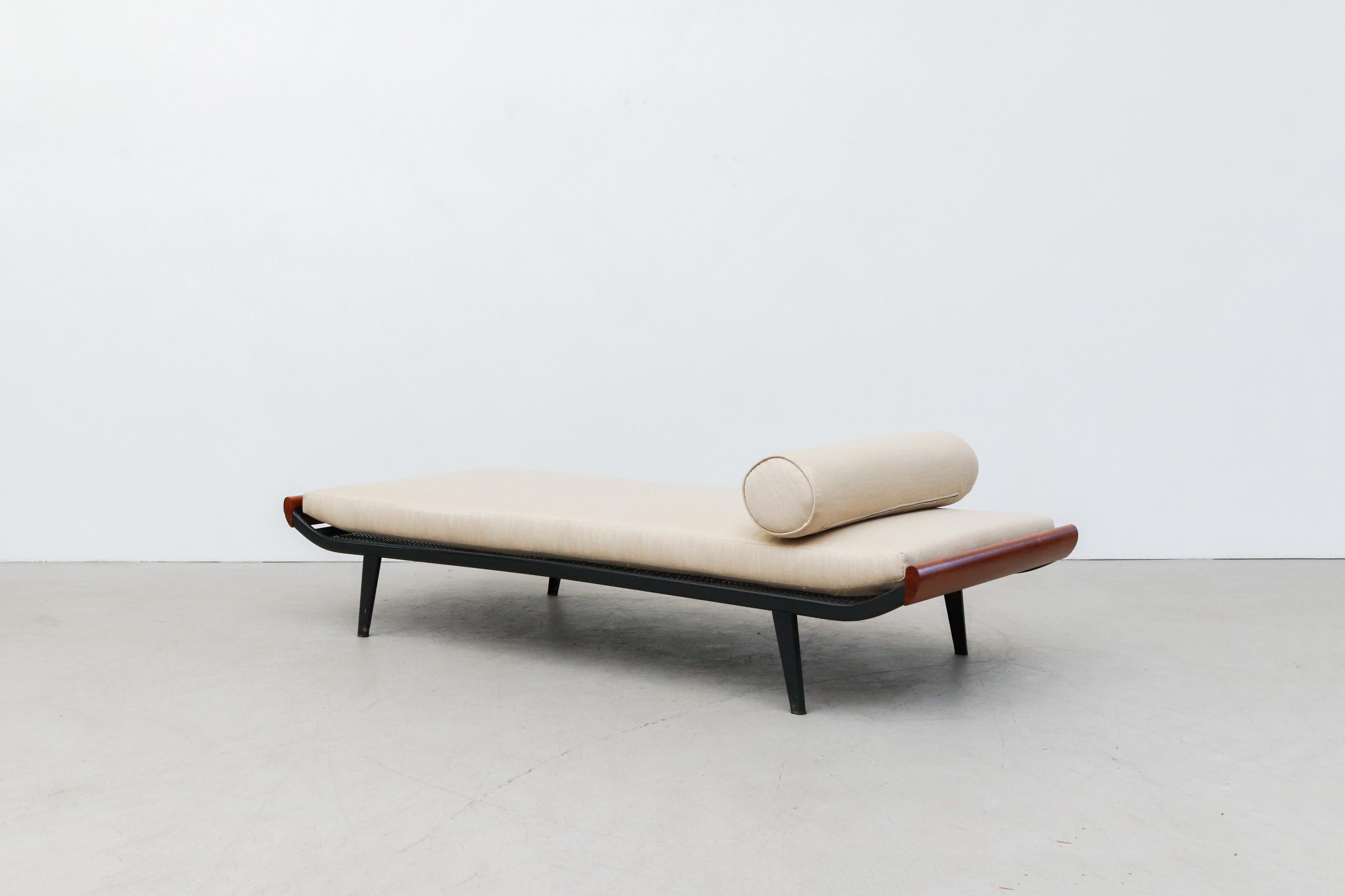 1960's Narrow 'Cleopatra' style daybed by A.R. Cordemeyer. New custom froth mattress on grey enameled metal frame with lightly refinished teak ends and matching bolster. Frame is in overall original condition with some visible wear consistent with