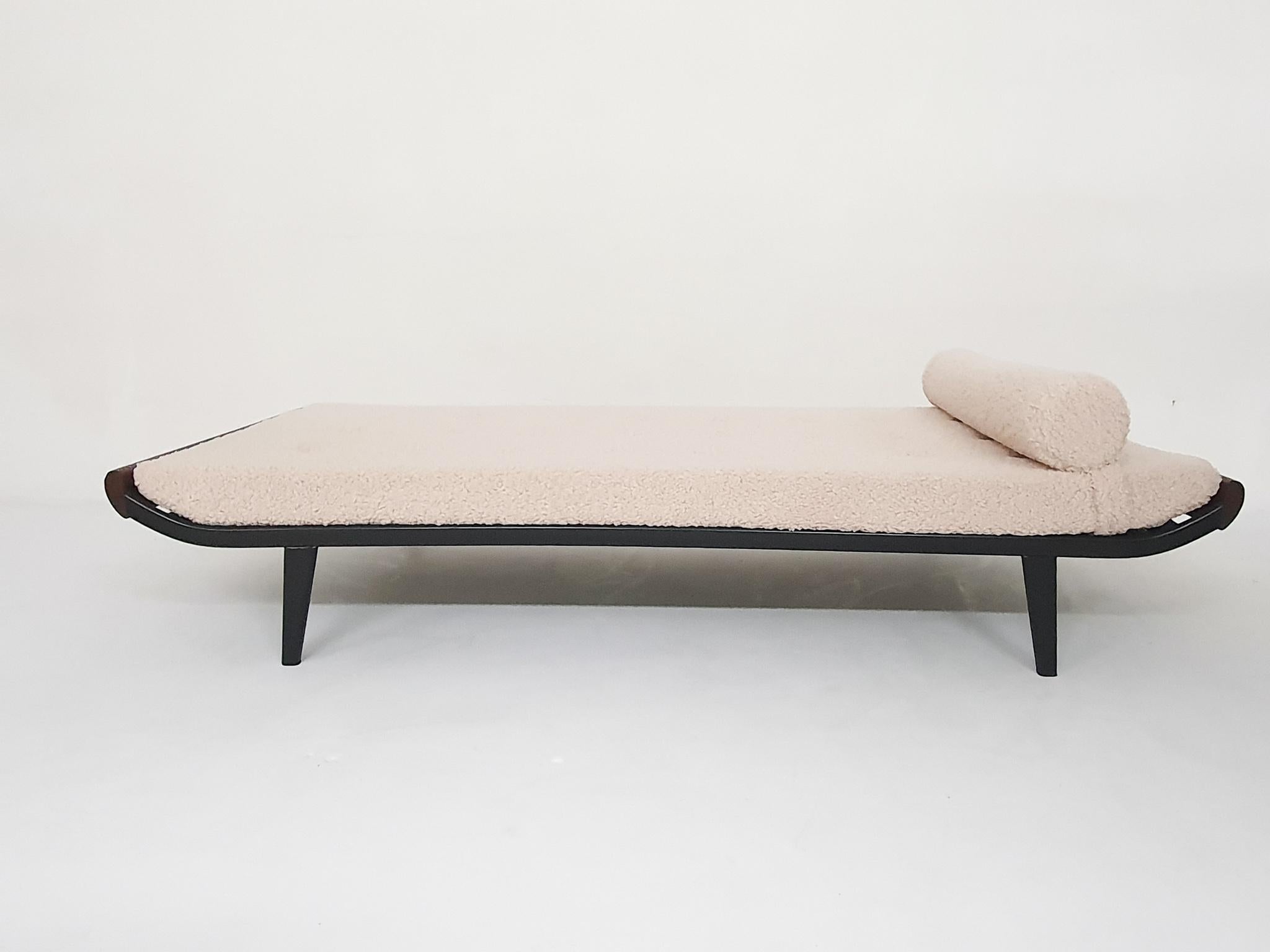 Black metal daybed with teak details and a new cushion with new off white 
