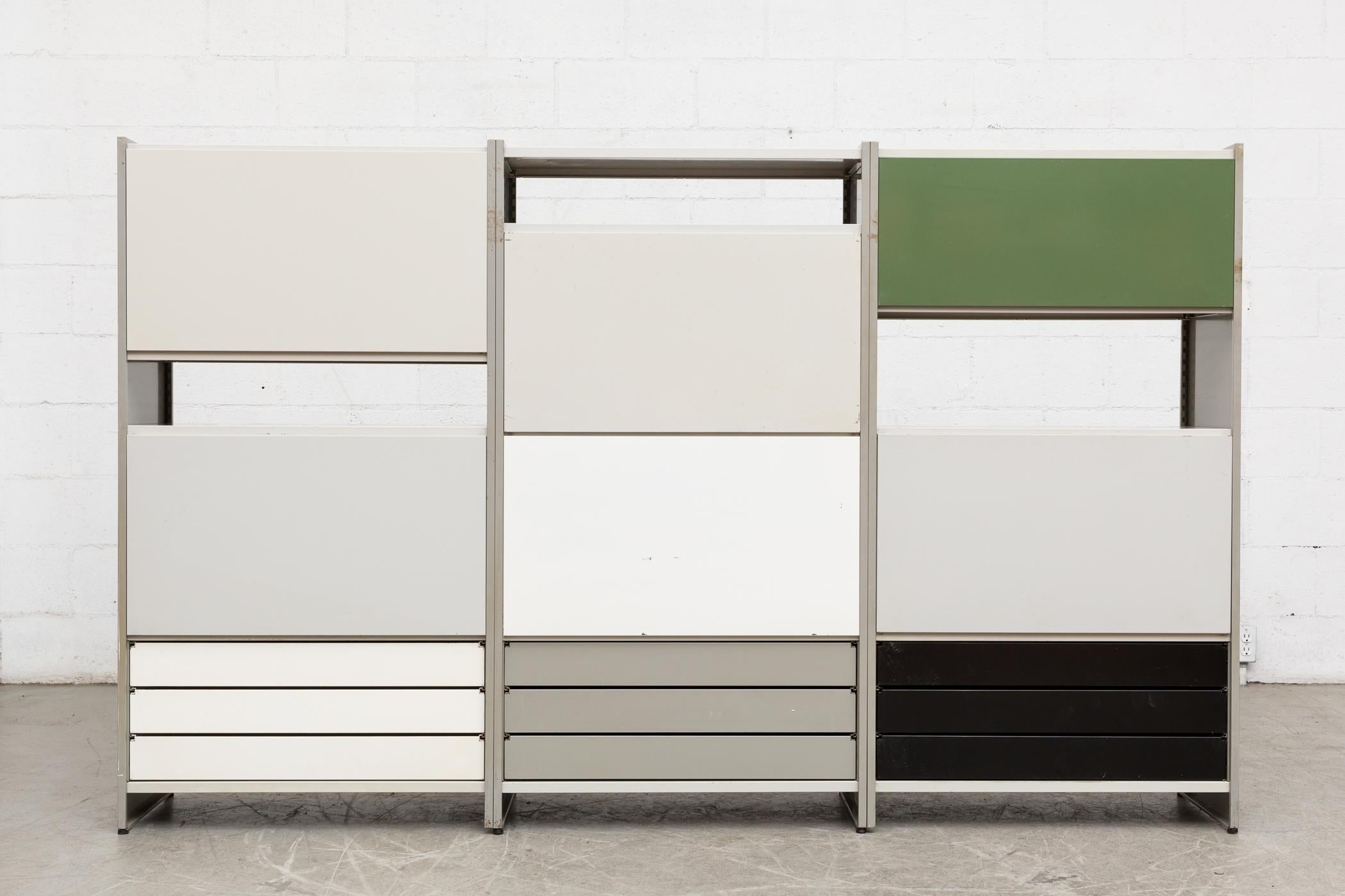 Large Gispen 5600 industrial shelving unit by A.R. Cordemeyer. Grey enameled metal three-section industrial bookshelf and storage unit with drop down desk and double purple metal drawers, a green back panel; two cabinets with enameled metal sliding