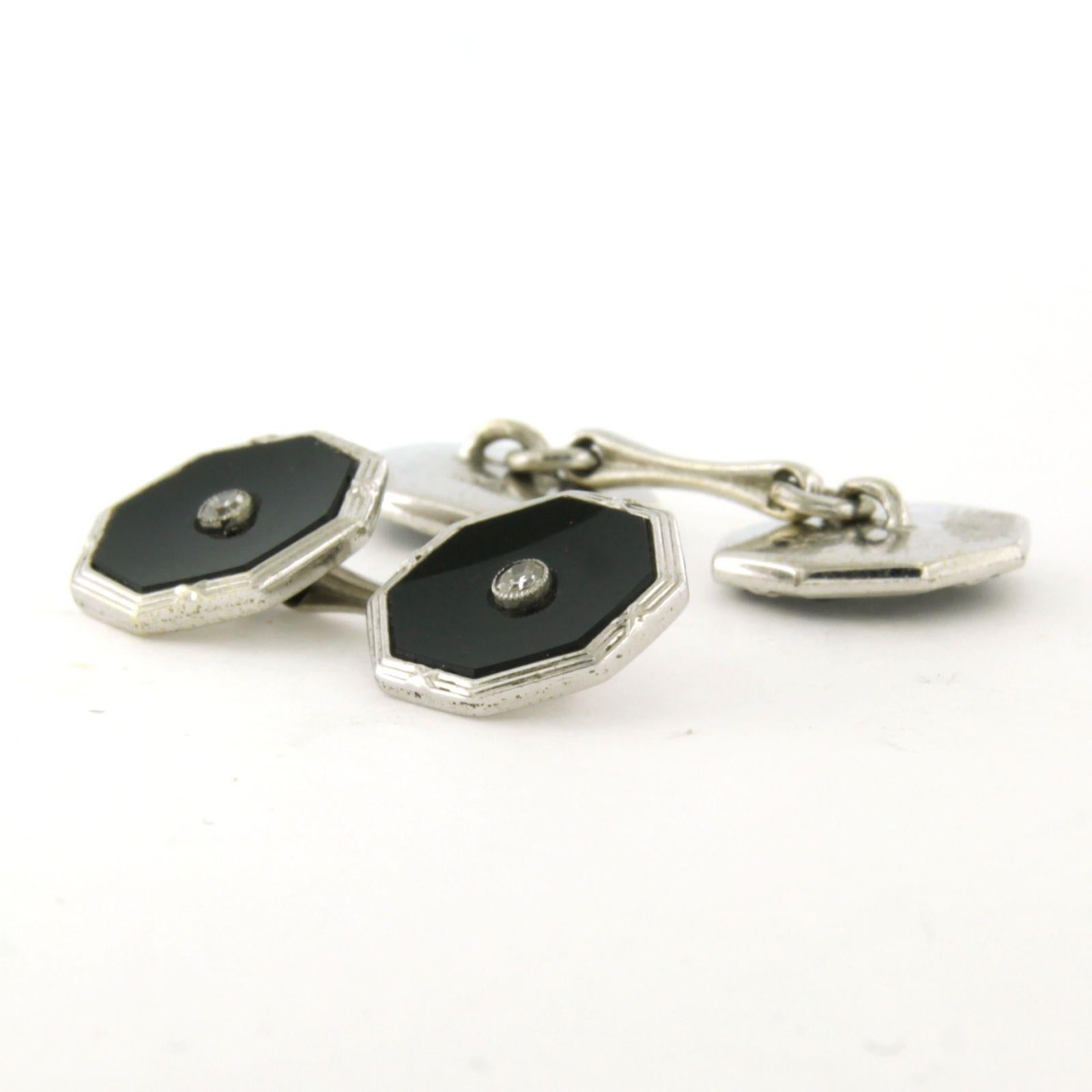 9k white gold cufflinks set with onyx and single cut diamond total 0.14 carat

detailed description:

The front of the cufflink is 1.25 cm by 1.25 cm

weight: 5.1 grams

set with:

- 2 x 10 mm x 10 mm flat octagonal cut onyx
colour black
purity