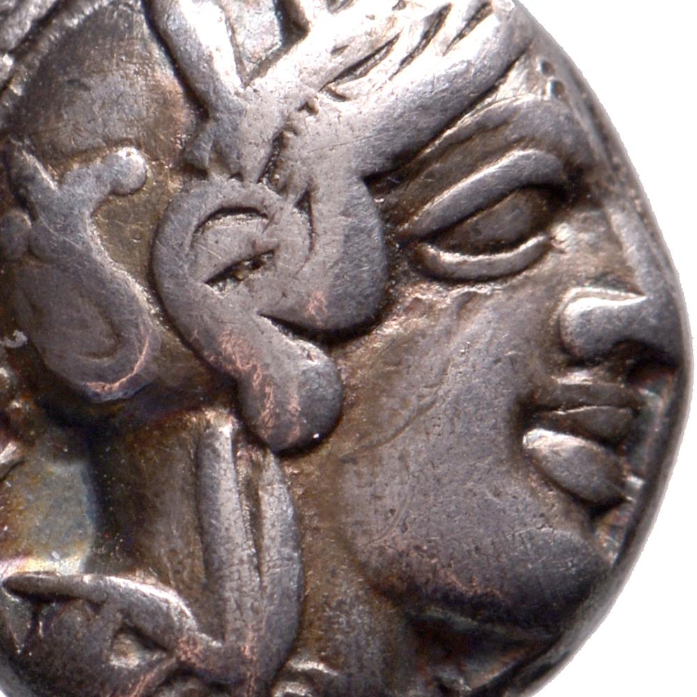 Obverse: head of Athena right, wearing earring, necklace, and crested Attic helmet decorated with three olive leaves over visor and spiral palmette
Reverse: owl standing right with head facing, olive sprig with berry in upper left field, AΘE to