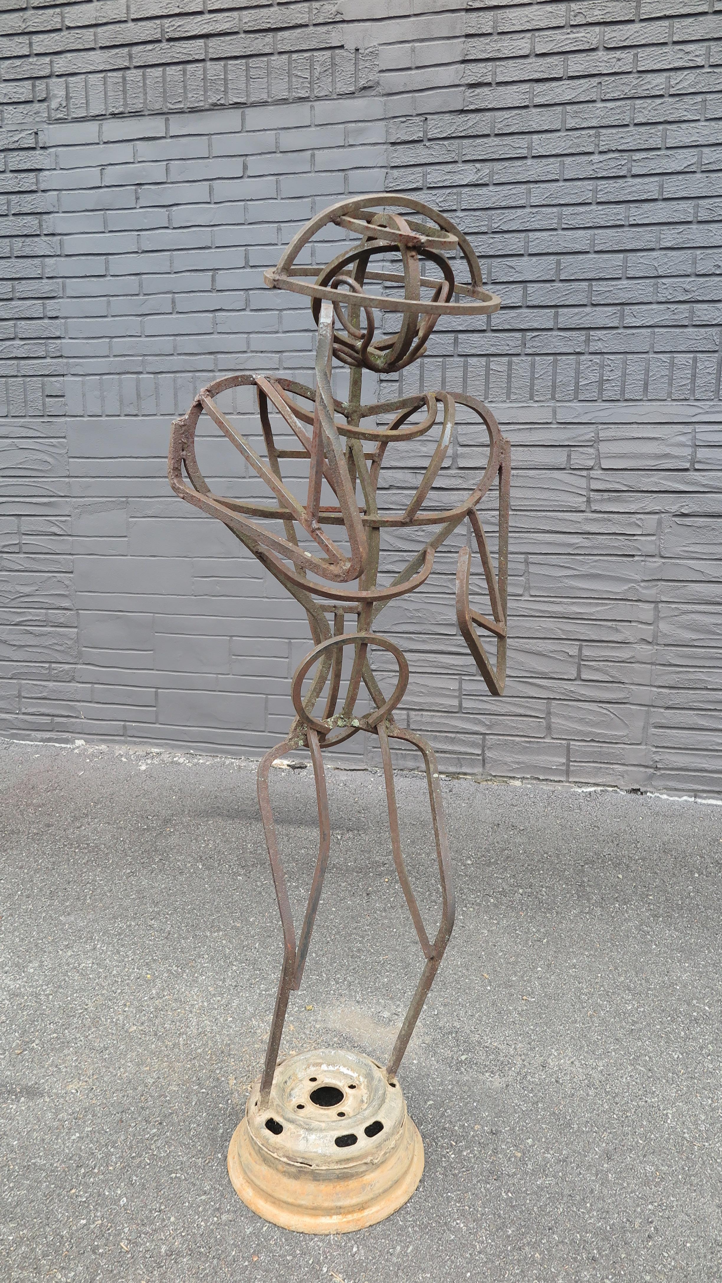 Metal Bee Keeper sculpture by A.R. Gately, noted American Folk Artist. A outdoor Bee Keeper Sculpture made of metal bar and metal parts. A life size outdoor Sculpture that will enhance your outdoor space while presenting American Folk Art. A.R.